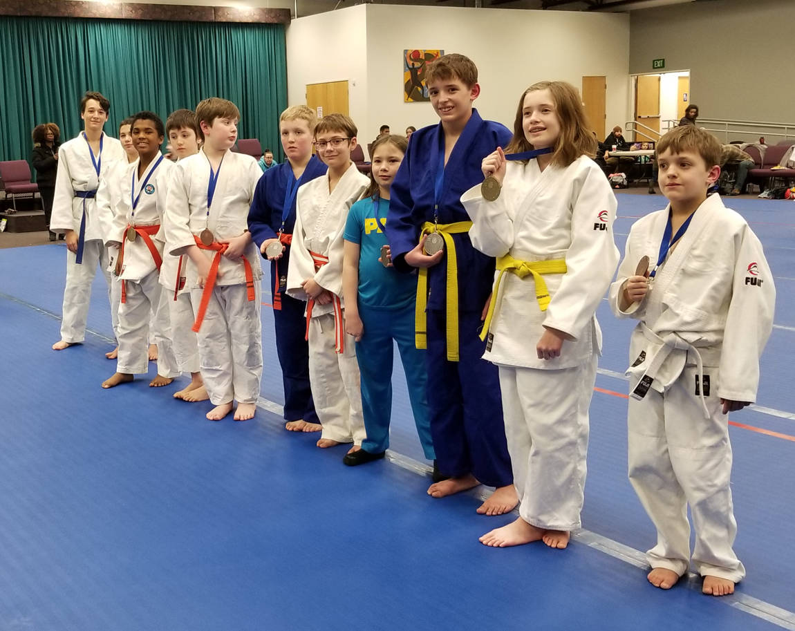 Sterling Judo Club students receive awards at a tournament in January.