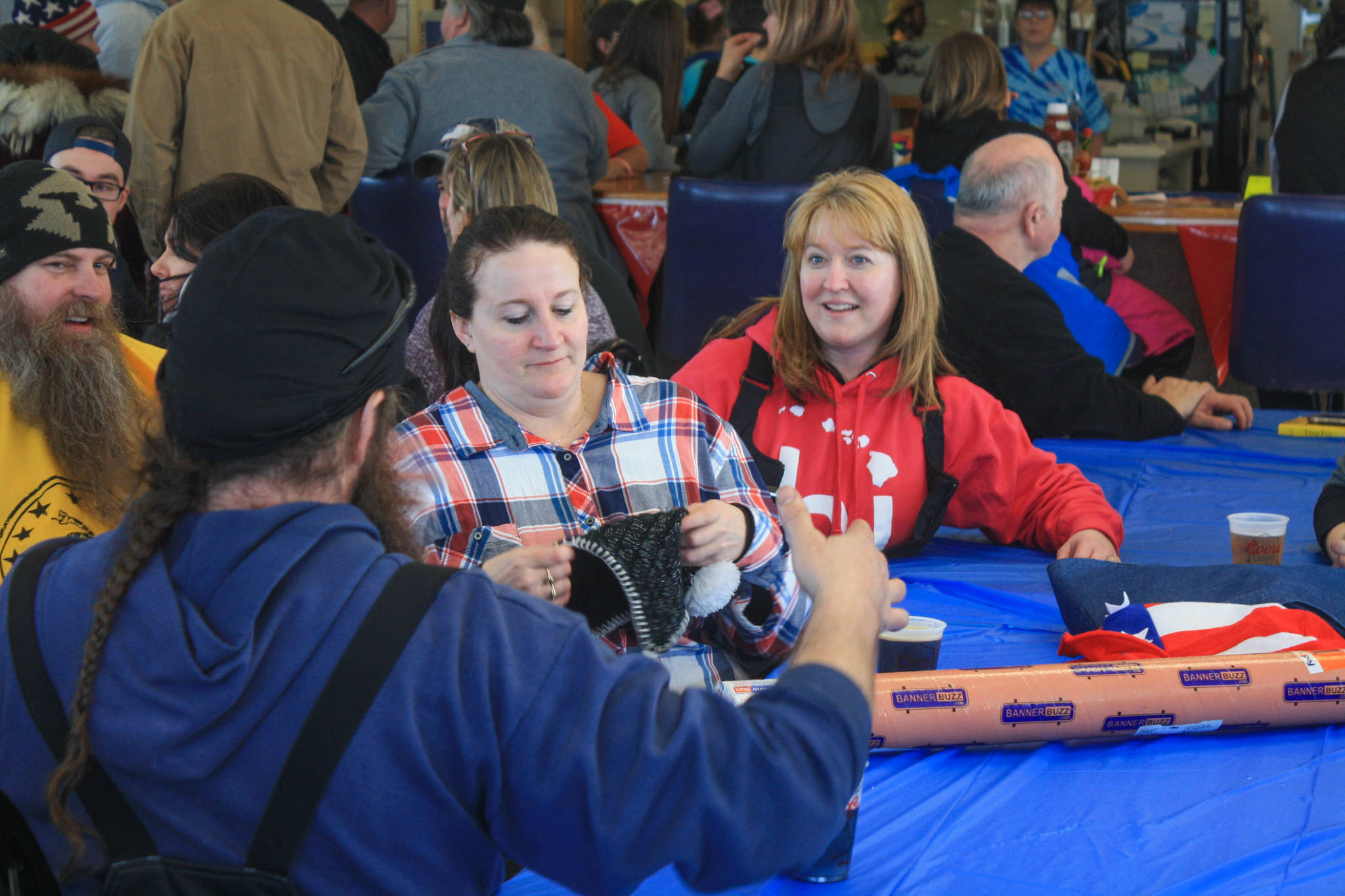 Participants in the Way Our Women Ride fundraiser enjoy food and friends at Freddie’s Roadhouse on Saturday, Feb. 24, 2017 near Ninilchik, Alaska. (Photo by Erin Thompson/Peninsula Clarion)