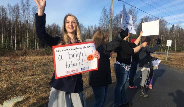 Callie Giordano, a teacher at Mountain View Elementary, participated in a rally on Tuesday, May 2, 2017 at the corner of Swires Road and the Kenai Spur Highway to support fully funding education. (Photo by Kat Sorensen/Peninsula Clarion)