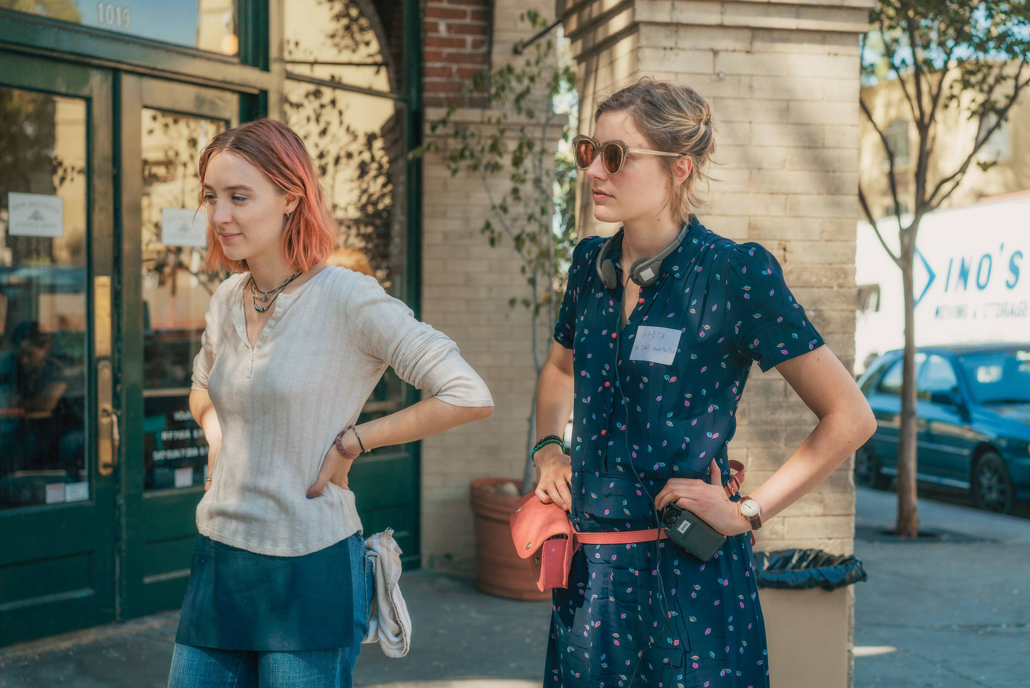 This image released by A24 Films shows director Greta Gerwig, right, and Saoirse Ronan on the set of “Lady Bird.” (Merie Wallace/A24 via AP)