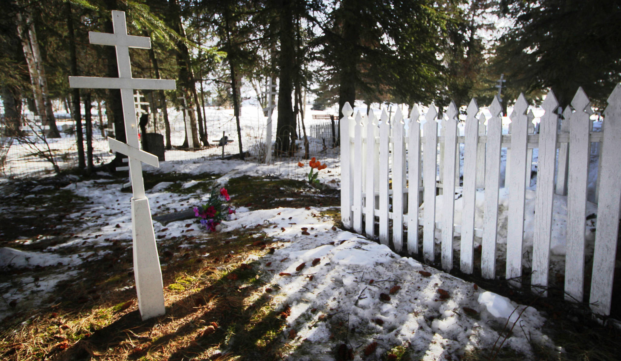 As burial space decreases in Kenai’s cemetery — pictured here on March 17, 2017 — the Kenai City Council is taking steps on a long-planned expansion. On Wednesday council members voted unanomously to fund engineering plans for converting the vacant lot adjacent to the existing cemetery across Floatplane Road into new cemetery grounds. Construction of the expansion may begin this year. (Ben Boettger/Peninsula Clarion)
