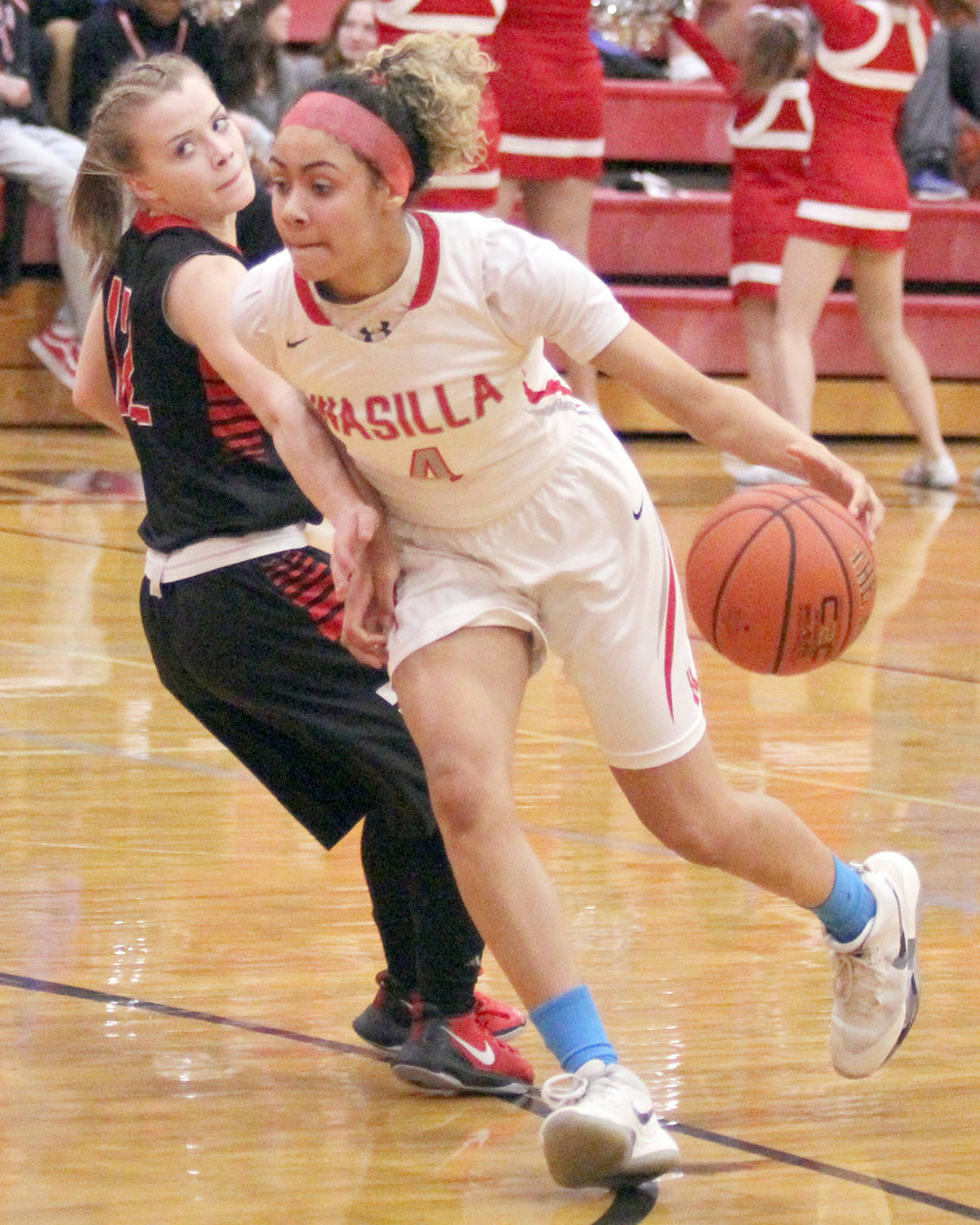Kenai Central’s Hayley Maw tries to stay in front of Wasilla’s Olliva Davies during Wasilla’s 62-36 win over Kenai in the Northern Lights Conference Championships girls semifinals Friday, March 9, 2018, at Wasilla High. (Photo by Jeremiah Bartz/Frontiersman.com)