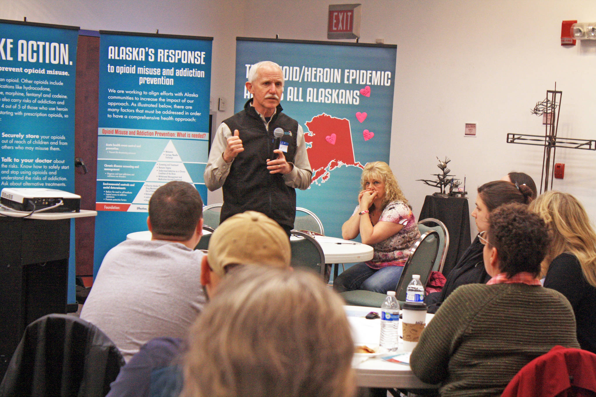 Jay Butler, chief medical officer for the Department of Health and Social Services, Division of Public Health, discusses the causes of the opioid crisis with members of the community at the Your Voice, Your Community forum on Thursday, March 8, 2018 at the Kenai Visitors and Cultural Center in Kenai, Alaska. (Photo by Erin Thompson/Peninsula Clarion)