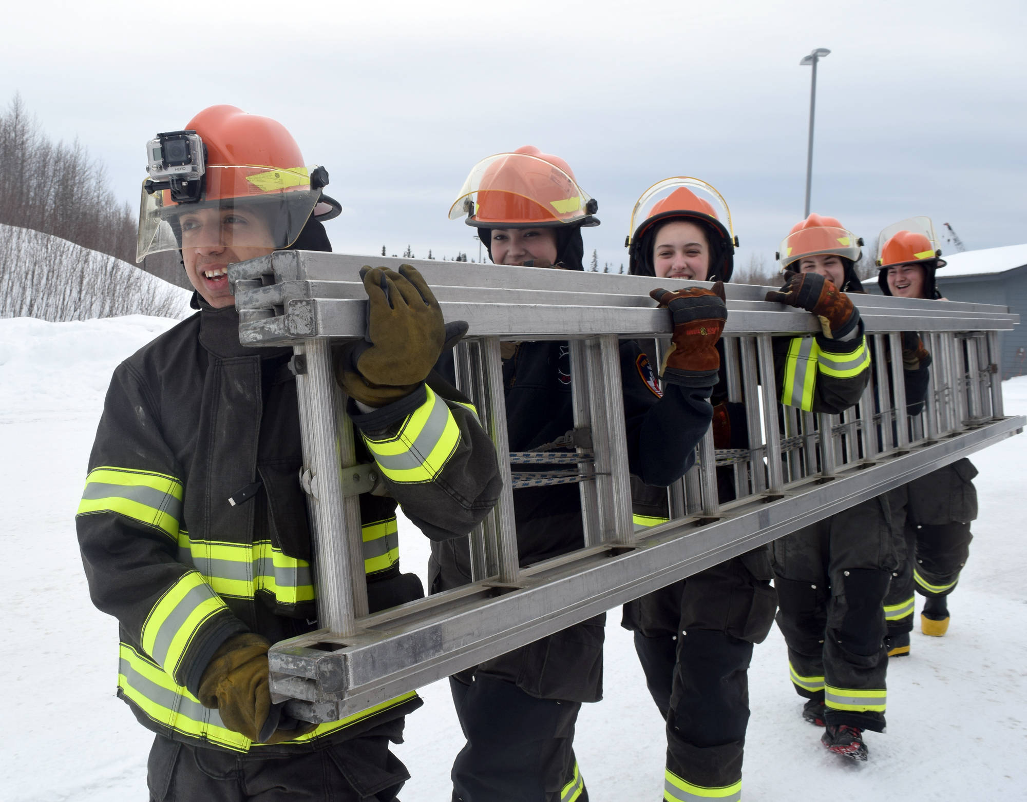 Joshua Diaz, a Kenai Central High School senior, leads his fellow students in a trianing exercise during Thursday’s basic firefighting academy at Nikiski Fire Station. (Photo by Kat Sorensen/Peninsula Clarion)