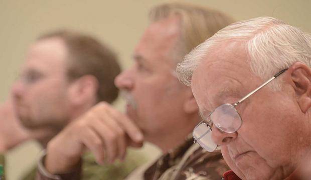 In this July 21, 2013 photo, Roland Maw takes notes during a hearing on the Magnuson Stevens federal fisheries management act in Kenai. (File photo)