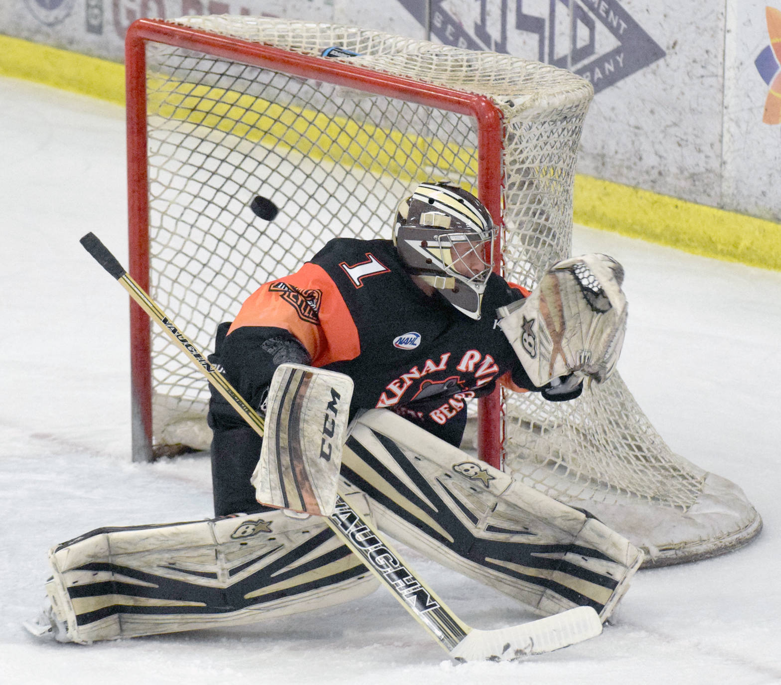 Kenai River Brown Bears goalie Gavin Enright gets help from the pipe Thursday, March 15, 2018, against the Springfield (Illinois) Jr. Blues at the Soldotna Regional Sports Complex. (Photo by Jeff Helminiak/Peninsula Clarion)