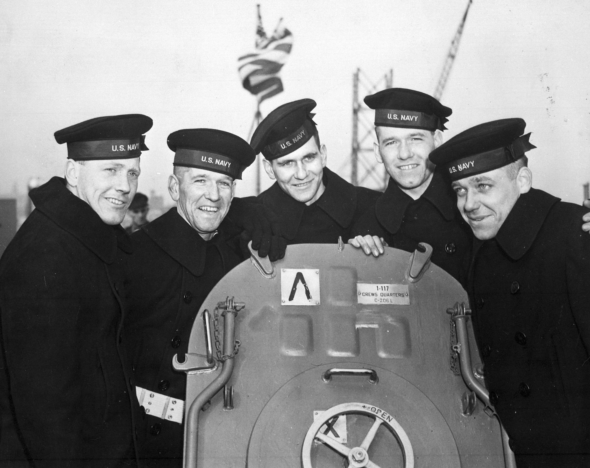 This Feb. 14, 1942 photo provided by the U.S. National Archives shows the five Sullivan brothers on board USS Juneau (CL-52) at the time of her commissioning ceremonies at the New York Navy Yard. The brothers who were all killed in the World War II sinking of the USS Juneau on Nov. 13, 1942. From left to right: Joseph, Francis, Albert, Madison and George Sullivan. Wreckage from the USS Juneau, a Navy ship sunk by the Japanese 76 years ago, has been found in the South Pacific. (U.S. National Archives via AP)