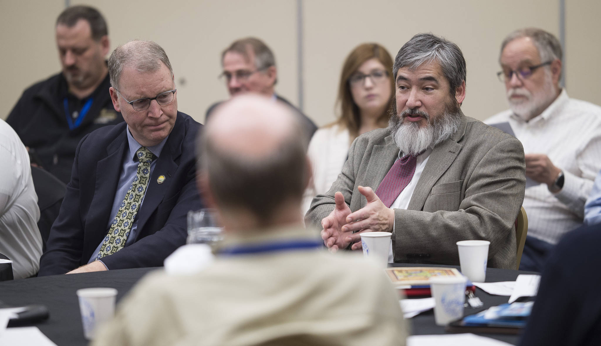 Rep. Sam Kito III, D-Juneau, right, speaks alongside Marc Luiken, Commissioner of the Department of Transportation and Public Facilities during a breakout session on Alaska Marine Highway System Reform at Southeast Conference at the Elizabeth Peratrovich Hall on Wednesday, Feb. 14, 2018. Kito said this week that he will not seek re-election. (Michael Penn | Juneau Empire File)