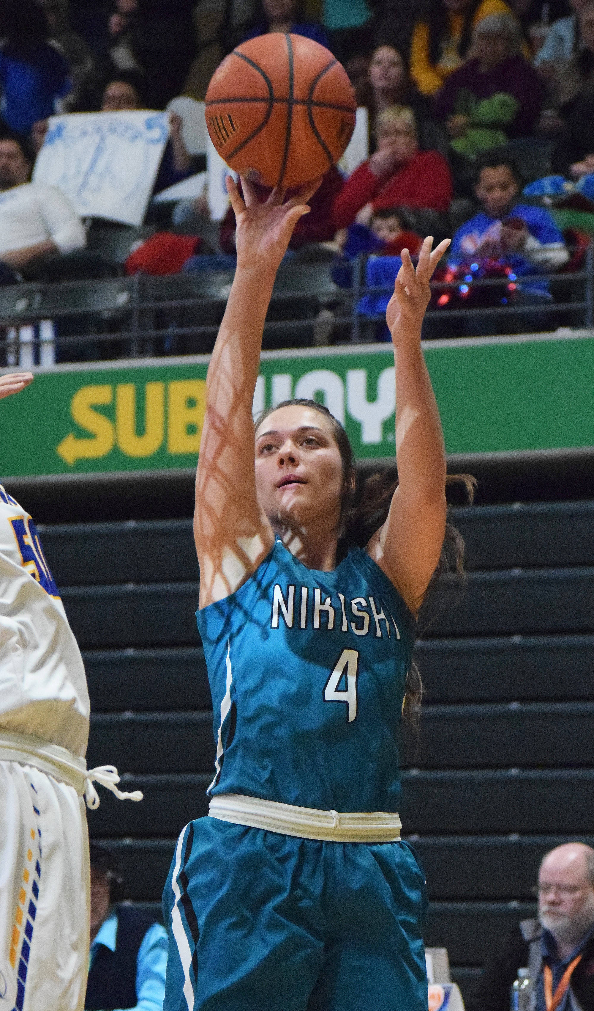 Nikiski’s Emma Wik unleashes a jumpshot over the Barrow Whalers, Thursday evening at the Class 3A state tournament at the Alaska Airlines Center. (Photo by Joey Klecka/Peninsula Clarion)