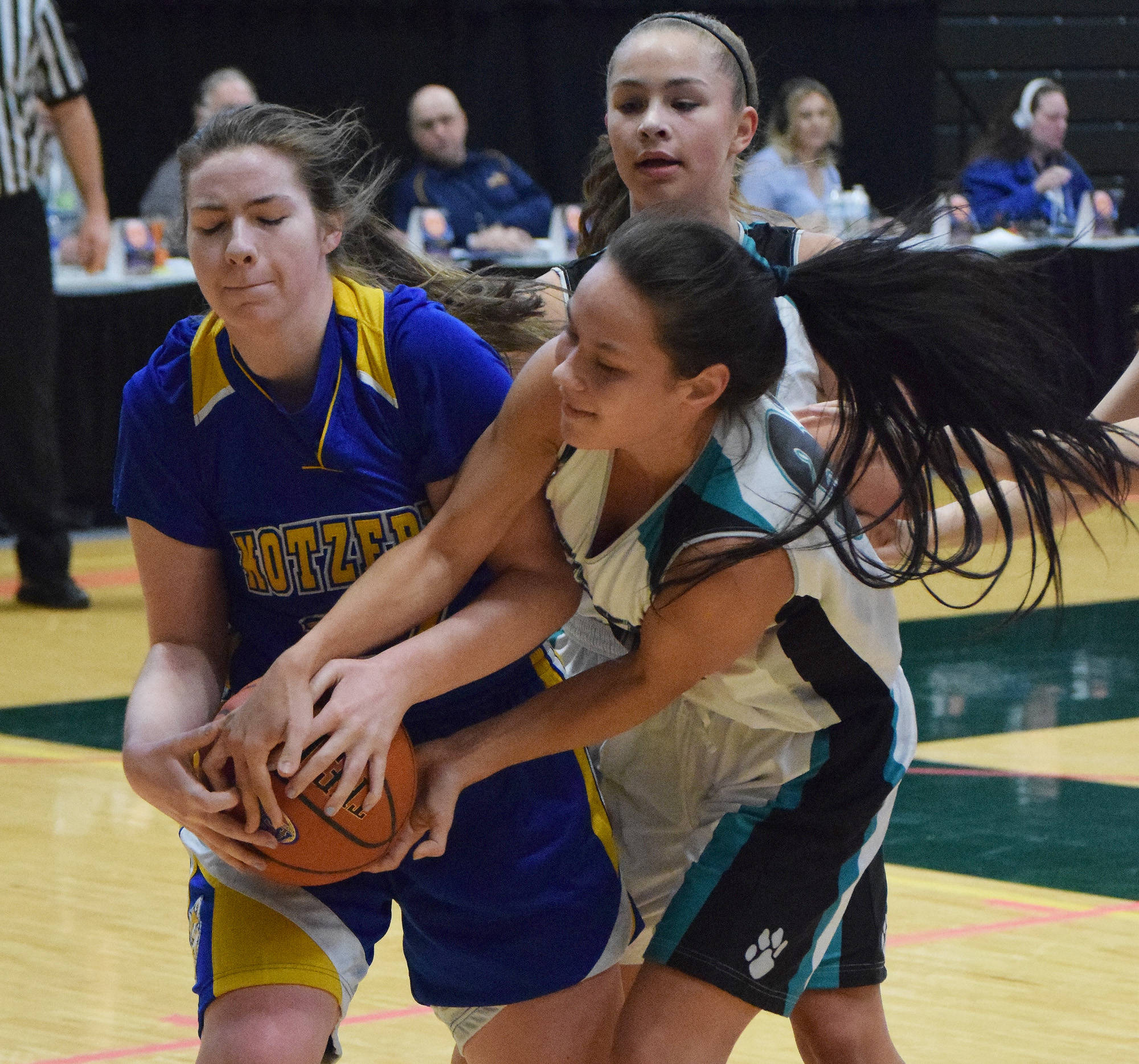 Kotzebue’s Payton McConnell (left) battles for a rebound with Nikiski’s Rylee Jackson, Friday at the Class 3A state tournament at the Alaska Airlines Center. (Photo by Joey Klecka/Peninsula Clarion)