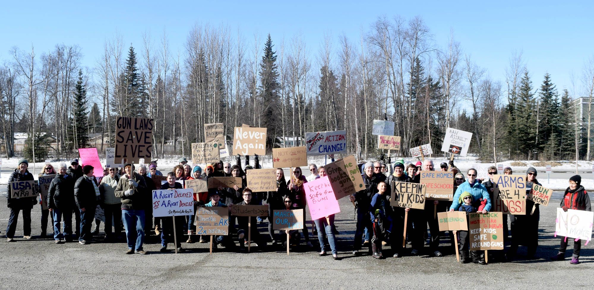 Community members walked from Christ Lutheran Church, along the Kenai Spur Highway, to the Kenai Peninsula Borough building in Soldotna on Saturday as part of the national March for Our Lives rally, which took place in cities and towns across the country in support of gun control laws. (Photo by Kat Sorensen/Peninsula Clarion)