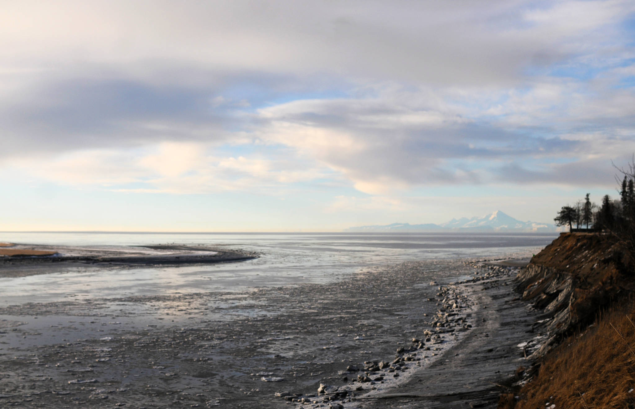 In this Jan. 18, 2018 photo, patchy ice floats near the mouth of the Kenai River in Kenai, Alaska. Most of Alaska experienced a warmer, wetter winter than average from 2017&