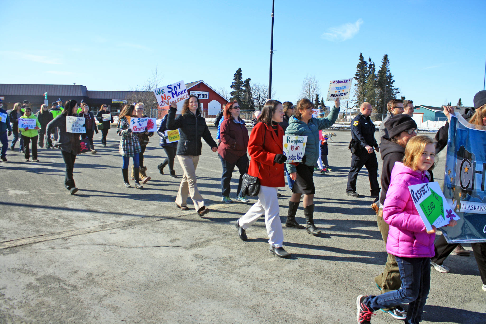 Marchers arrive at the Kenai Visitor and Cultural Center during the Alaskans Choose Respect Awareness Event, hosted by the LeeShore Center, on Wednesday, March 28 in Kenai. The march aimed to draw attention to the issue of sexual assault and domestic violence. (Photo by Erin Thompson/Peninsula Clarion)