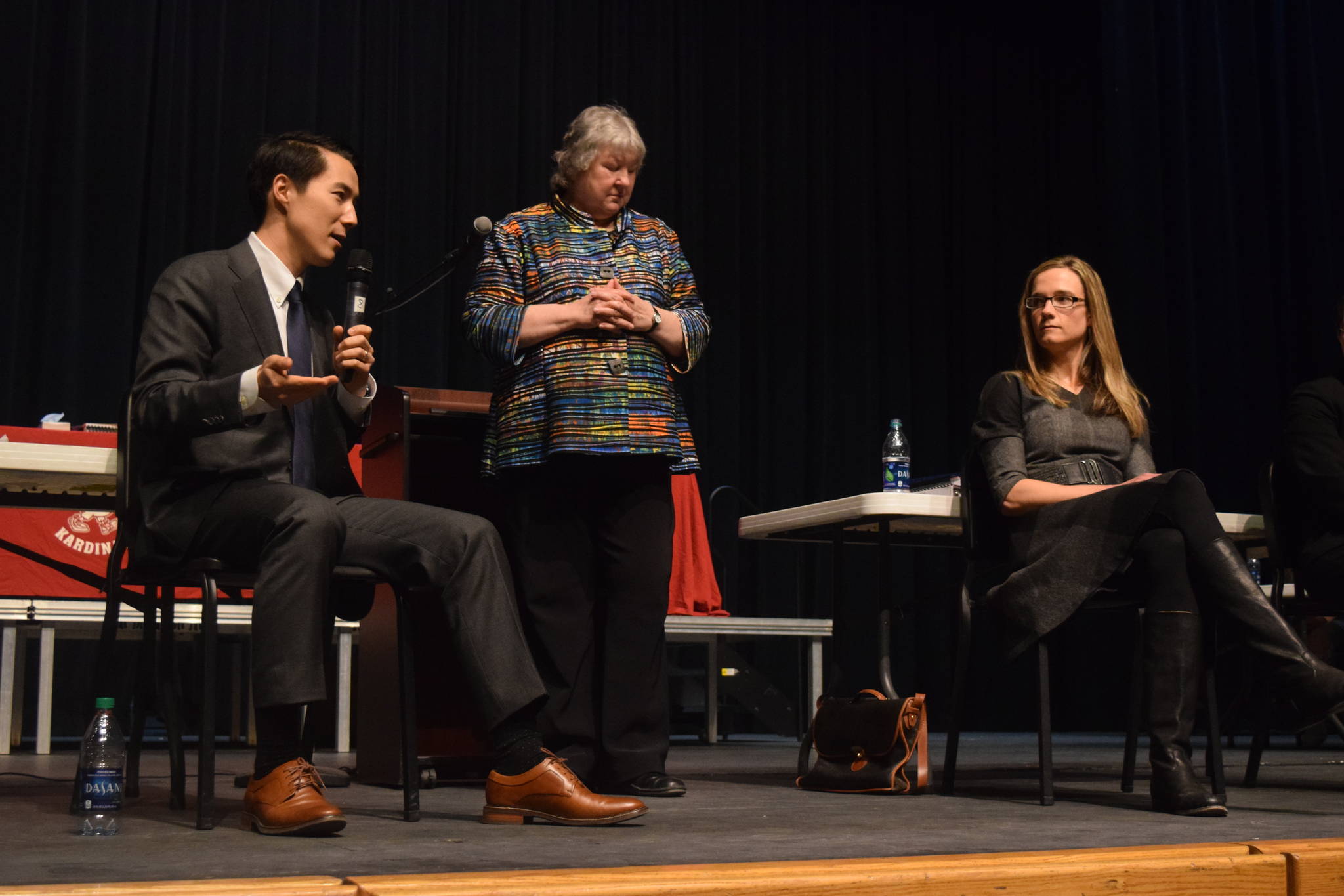 Attorney Jon Choate, left, representing the Alaska Democratic Party, and state attorney Laura Fox, discuss the ins and outs of the case after the oral arguments on Thursday as part of the Supreme Court Live event moderated by Marilyn May, center, at Kenai Central High School. (Photo by Kat Sorensen/Peninsula Clarion)