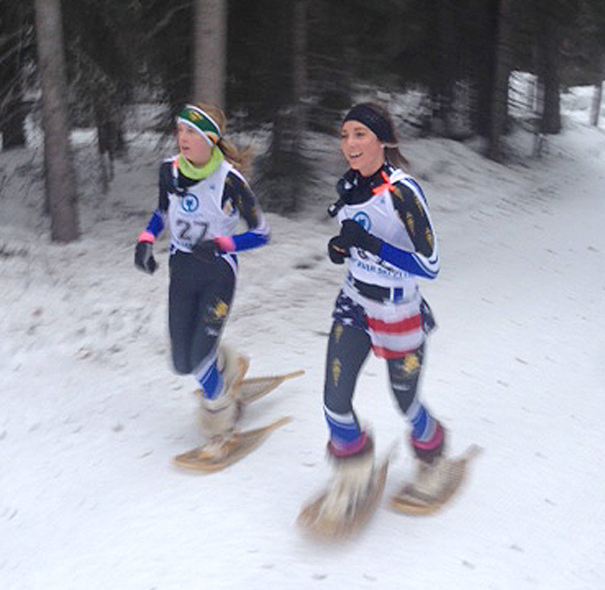 Kenai’s Riana Boonstra (right) races with Alaskan teammate Clare Howard at the 25th biannual Arctic Winter Games in Hay River, Canada. (Photo provided by Kelli Boonstra)