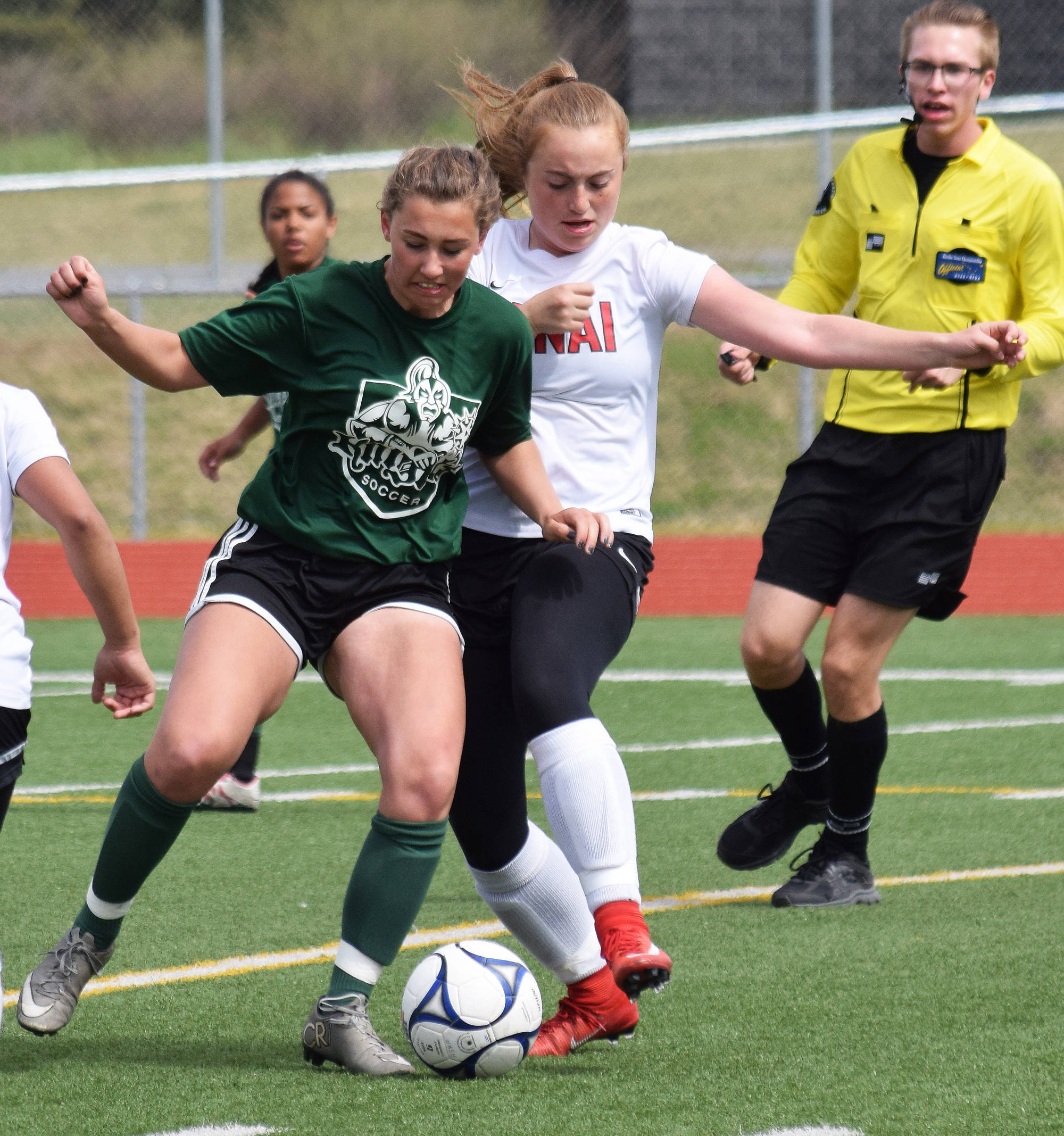 Kenai Central’s Liz Hanson (right) battles for possession with a Colony player in a consolation semifinal May 26, 2017, at the girls state soccer tournament at Eagle River High School. (Photo by Joey Klecka/Peninsula Clarion)