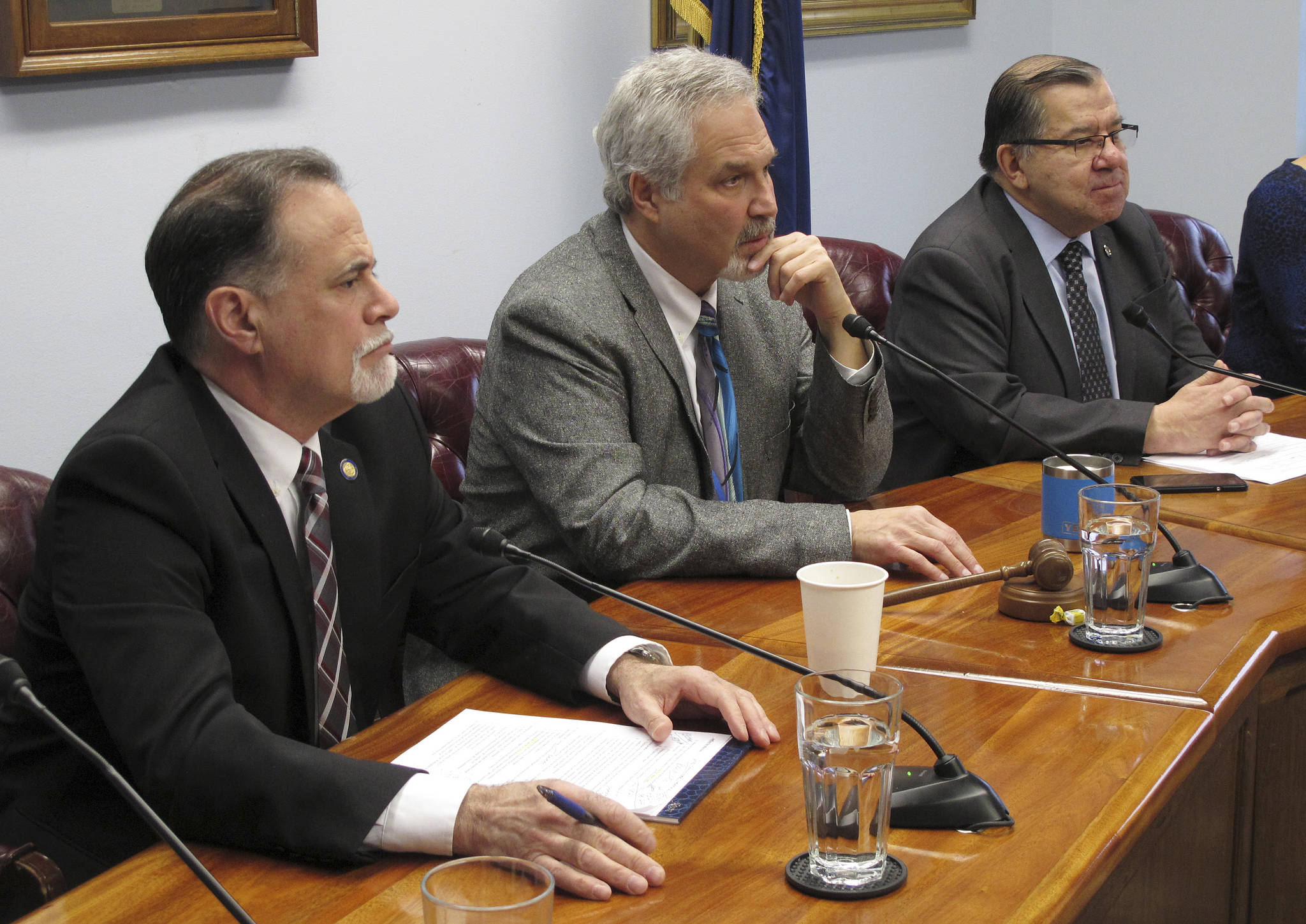 Three members of the Alaska Senate majority’s leadership listen to questions during the majority’s weekly news conference on Monday in Juneau. Pictured are, from left, Senate Majority Leader Peter Micciche, Senate President Pete Kelly and Senate Finance Committee Co-chair Lyman Hoffman. (AP Photo/Becky Bohrer)