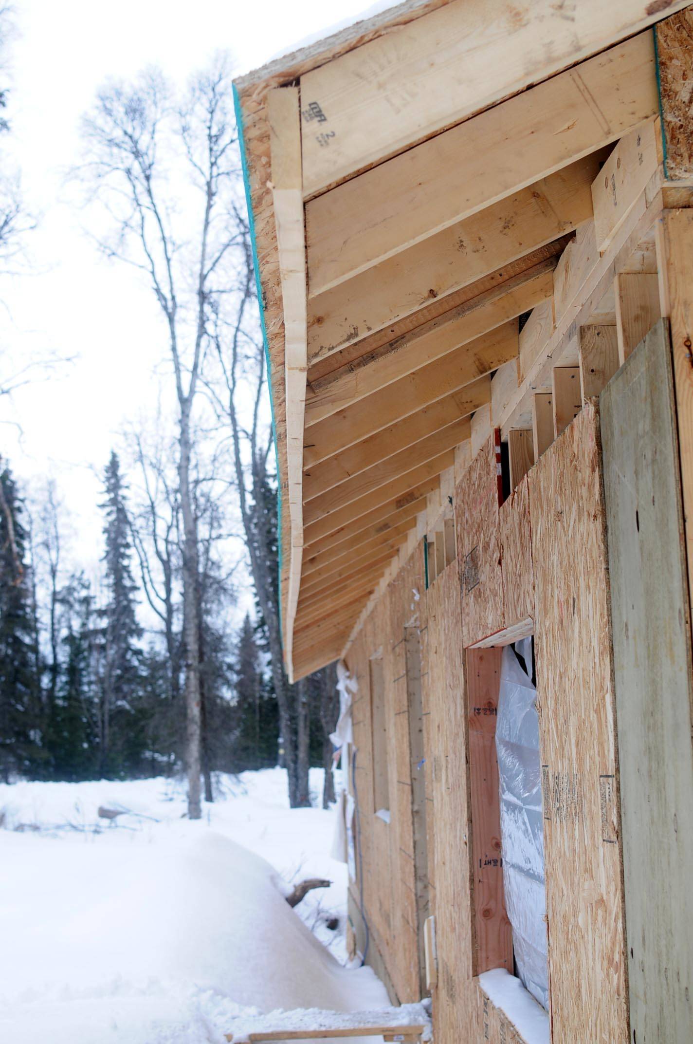 The outer fascia of the roof on Kimbra Mensch’s house is warped on Friday, March 9, 2018 in Nikiski, Alaska. Mensch, who moved to Nikiski from Wasill, engaged a contractor to build her a home on Cabin Lake but is now having to tear it down because of mistakes in the construction. (Photo by Elizabeth Earl/Peninsula Clarion)