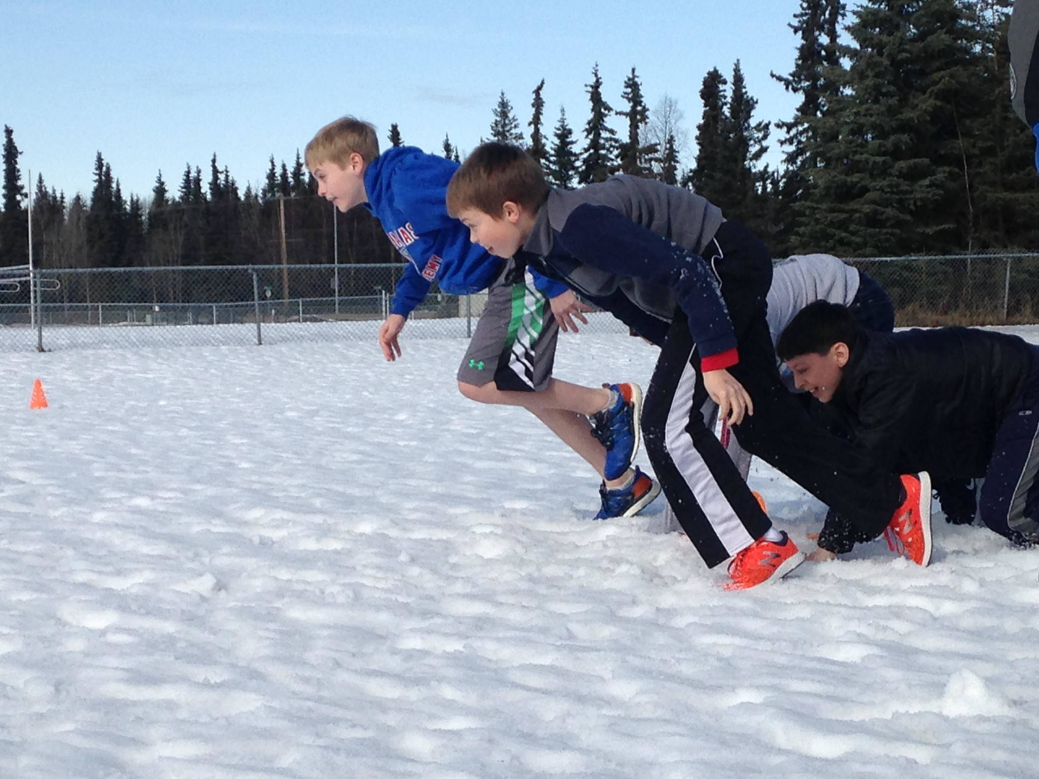 TOP: Kenai Middle School seventh graders Ben Boersma, Ky Calvert and Daniel Shelden participate in the FROST obstacle course. ABOVE: Kenai Middle School students ready to attend the awards banquet.