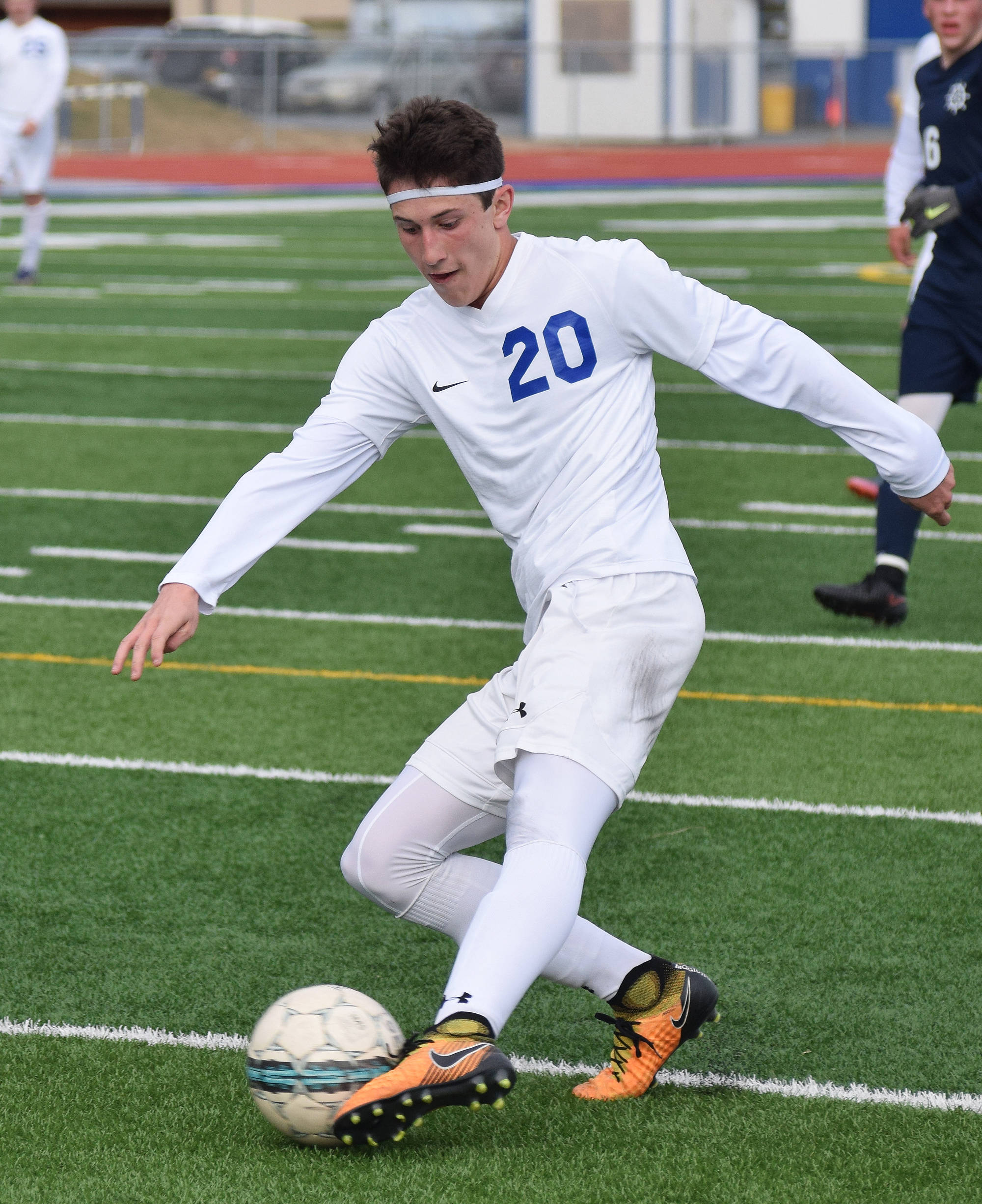 Soldotna’s Josh Hieber directs the ball towards the Homer goal Thursday afternoon in a Peninsula Conference contest at Soldotna High School. (Photo by Joey Klecka/Peninsula Clarion)