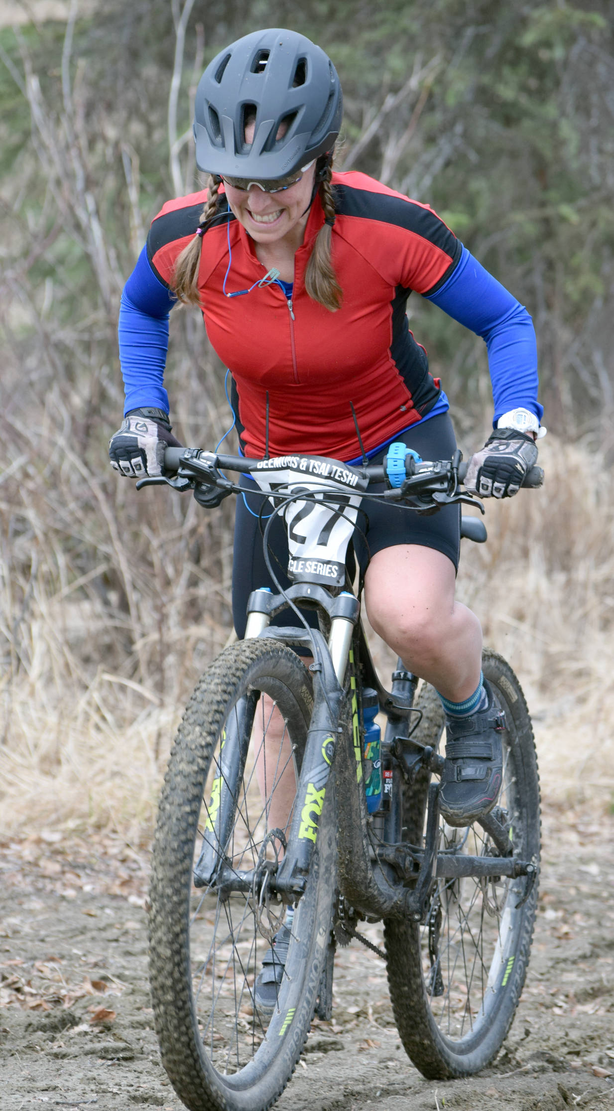 Angie Brennan powers up a hill Sunday, May 6, 2018, at May Cross at Tsalteshi Trails. (Photo by Jeff Helminiak/Peninsula Clarion)