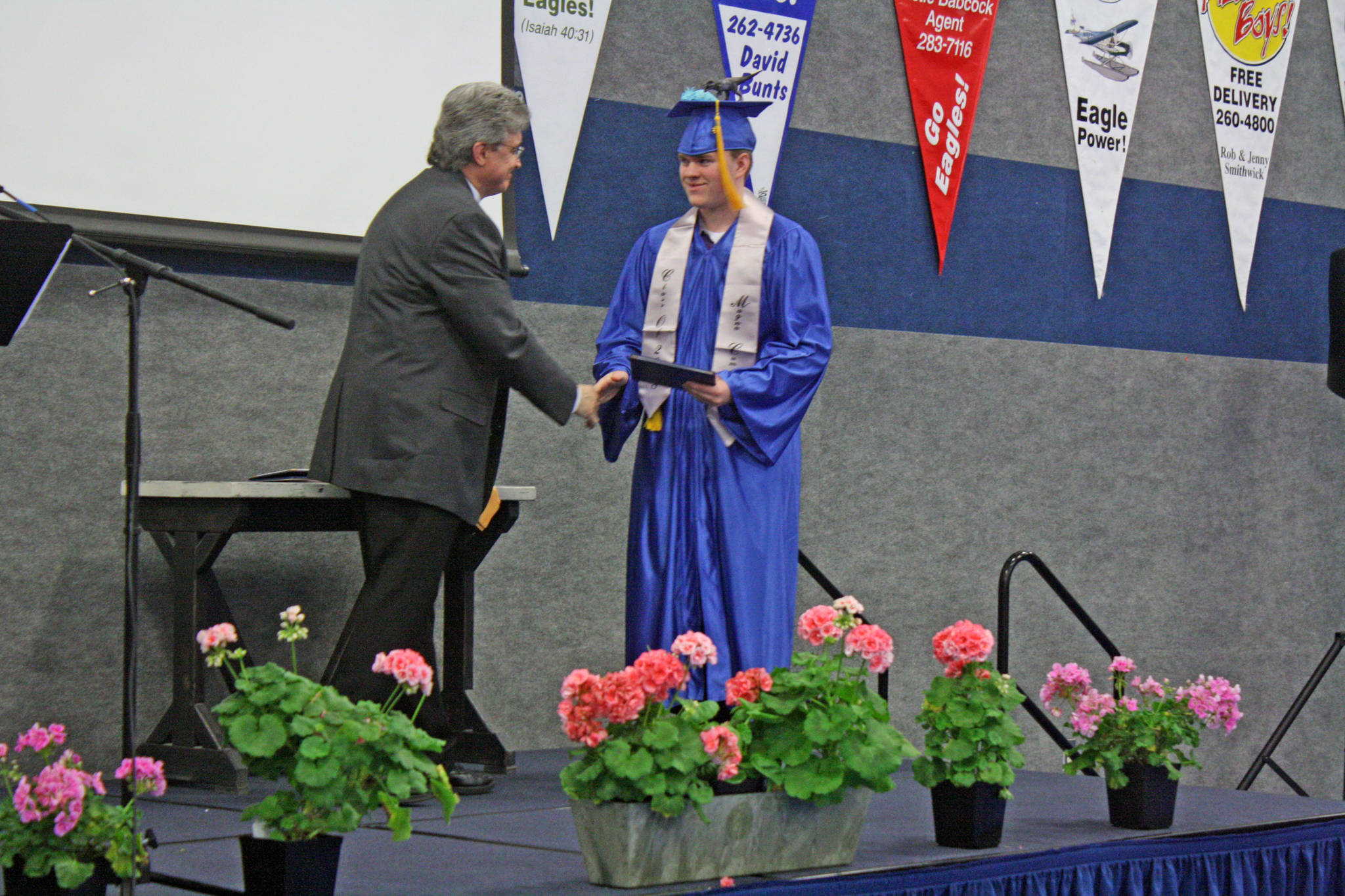 Gabriel Nicholas Bignell accepts his diploma from Cook Inlet Academy in Soldotna, Alaska, on Sunday, May 6. Bignell, who graduates magna cum laude, will attend University of Alaska Fairbanks in the fall and work to earn a degree in mechanical engineering. (Photo by Erin Thompson/Peninsula Clarion)