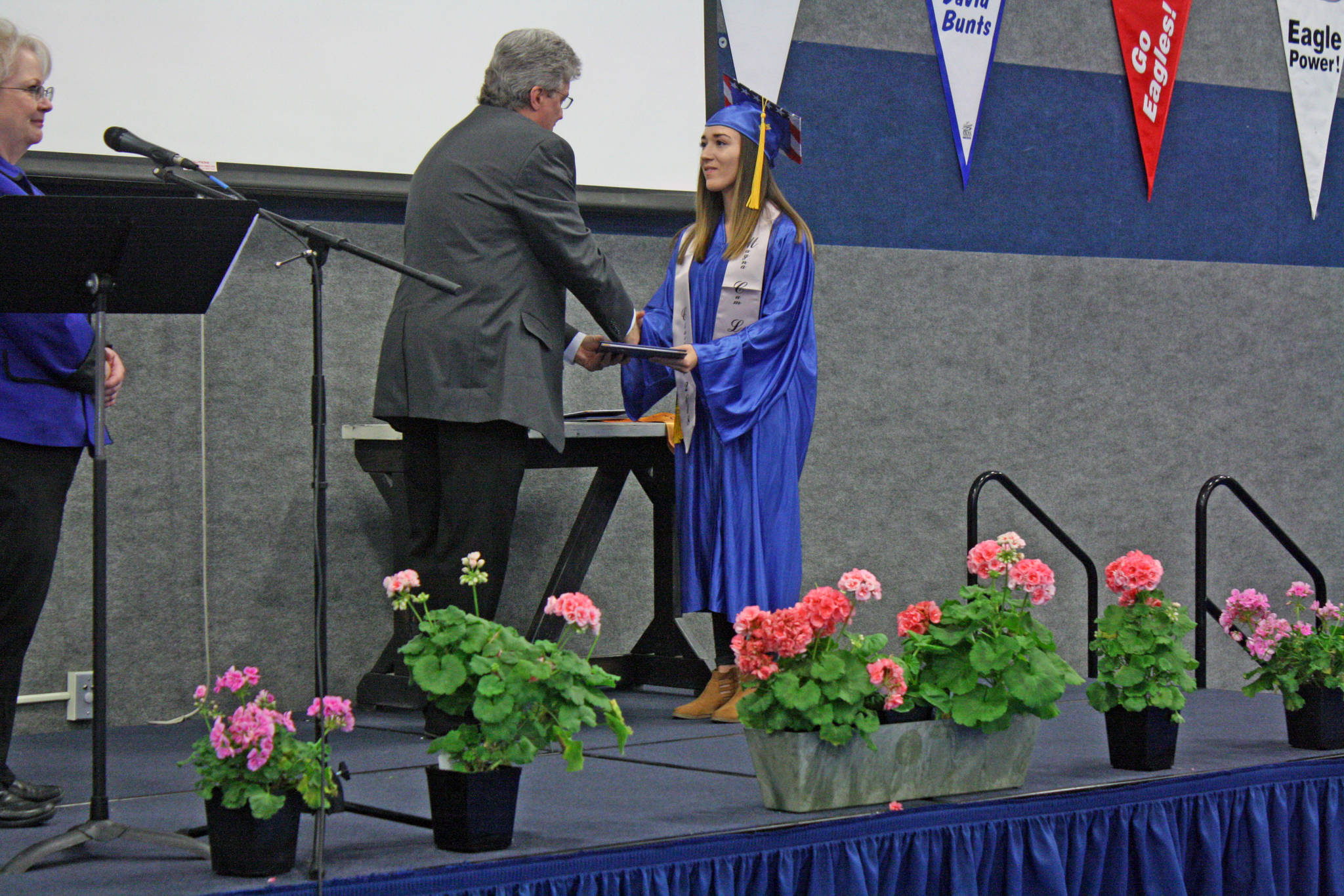 Breona Michele DeLon accepts her diploma from Cook Inlet Academy in Soldotna, Alaska, on Sunday, May 6. DeLon, who graduated magna cum laude, received a full-ride scholarship from the Naval Reserve Officers Training Corps to attend Point Loma Nazarene University in San Diego, where she will study social work with an emphasis on sociology. (Photo by Erin Thompson/Peninsula Clarion)