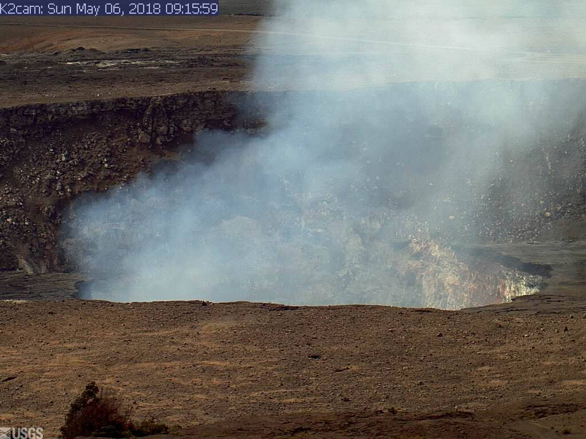 This Sunday, May 6, 2018, image from a research camera mounted in the observation tower at the Hawaiian Volcano Observatory and provided by the U.S. Geological Survey, shows the summit of the Kilauea volcano on the Big Island of Hawaii. The camera is looking south southeast towards the active vent in Halema&
