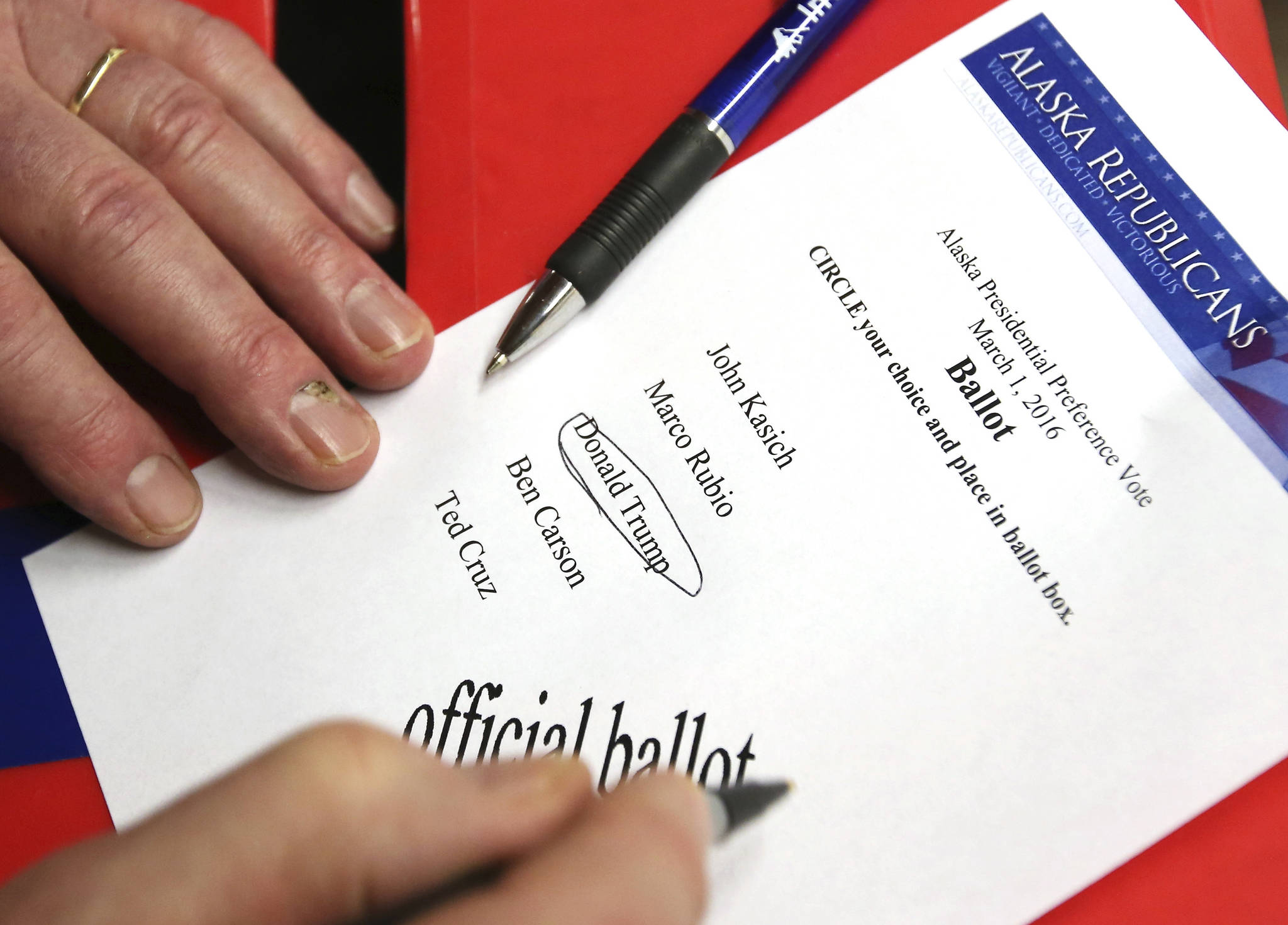 In this March 1, 2016, file photo, a Republican voter circles his choice for a Republican presidential candidate in Fairbanks, Alaska. Alaska officials say a hacker gained access to a server that hosts the state elections website on the morning of the 2016 general election but did not manipulate any information. (Eric Engman/Fairbanks Daily News-Miner via AP, file)