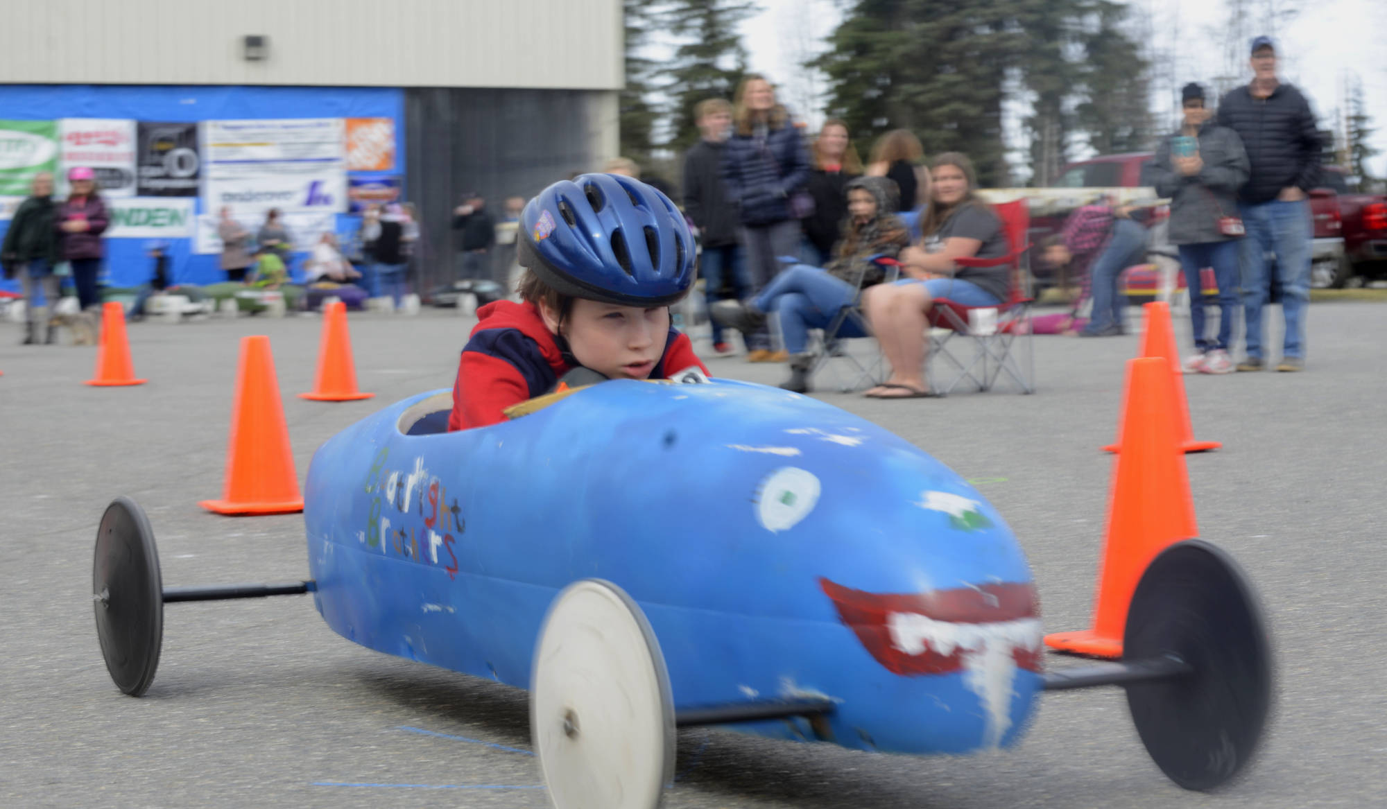 Nathanael Boatright races in the blue “Boatright Brothers” car during the Kenai Rotary Club’s 12th anual soapbox derby race on Saturday, May 12, 2018 at the Challenger Learning Center in Kenai Alaska. Since his family began racing in the derby over ten years ago, their blue car has been ridden by Nathanael’s four brothers and his sister. Nathanael placed second in Saturday’s race, beneath Maccoy Castillo, who qualified for the national All-American Soap Box Derby World Championship in Akron, Ohio. (Ben Boettger/Peninsula Clarion).