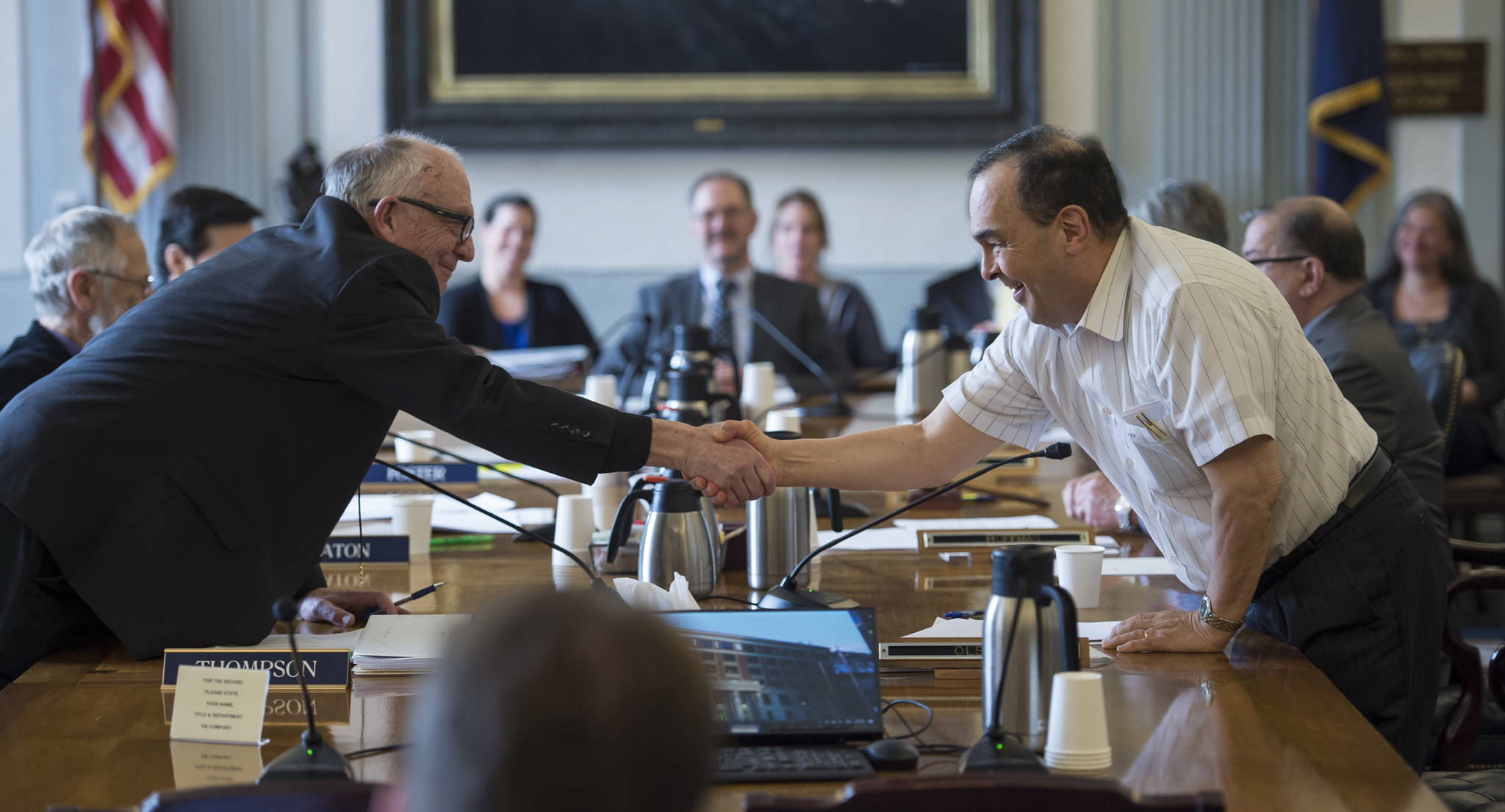 Conference Committee members Rep. Steve Thompson, R-Fairbanks, left, shakes hands with Sen. Donald Olson, R-Golovin, after the committee finished its work on the budgets at the Capitol on Thursday, May 10, 2018. (Michael Penn | Juneau Empire)