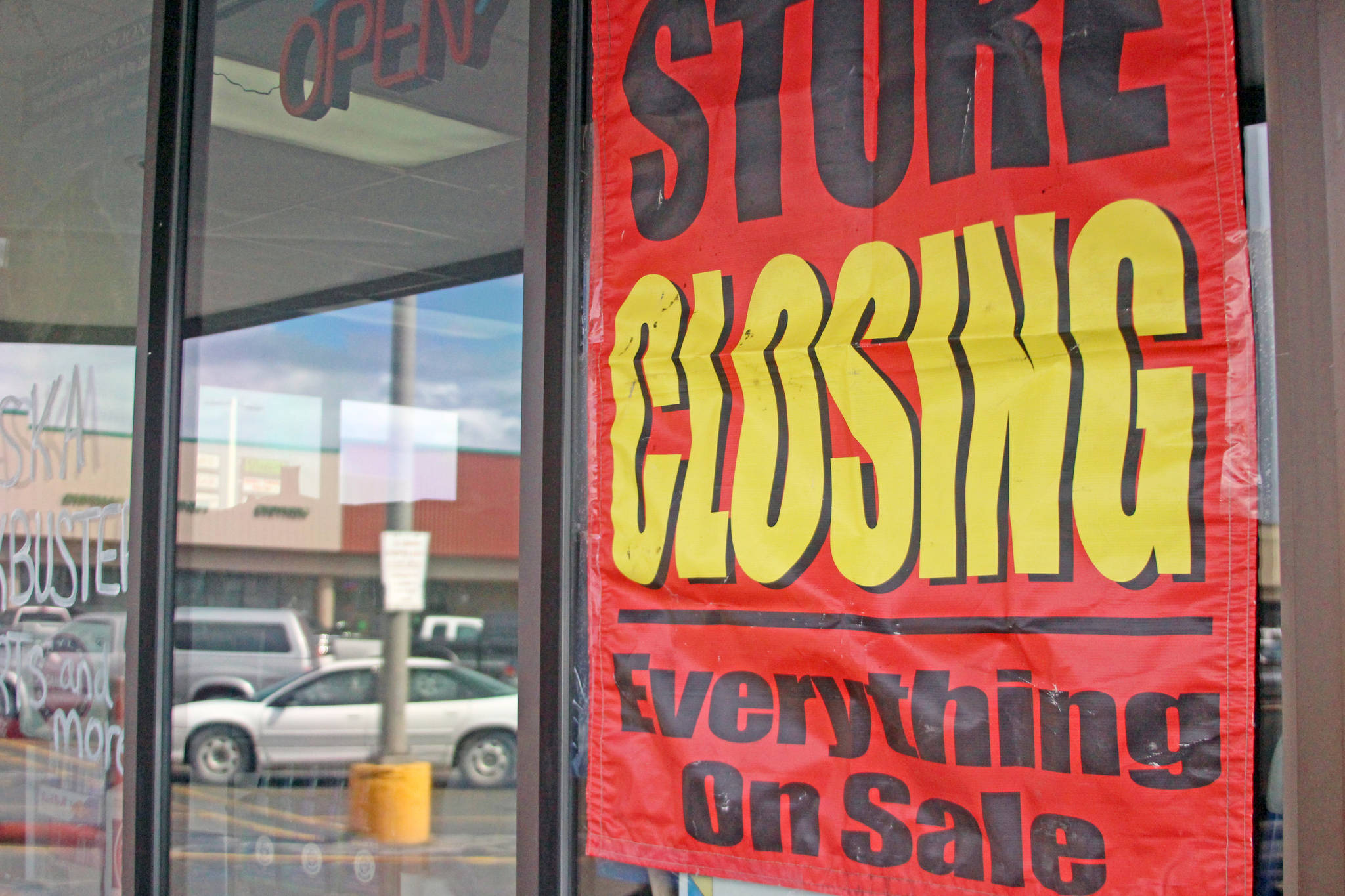 A sign outside the Soldotna Blockbuster advertises a close-out sale. The video rental store will shutter its doors this week after more than two decades in operation. (Photo by Erin Thompson/Peninsula Clarion)