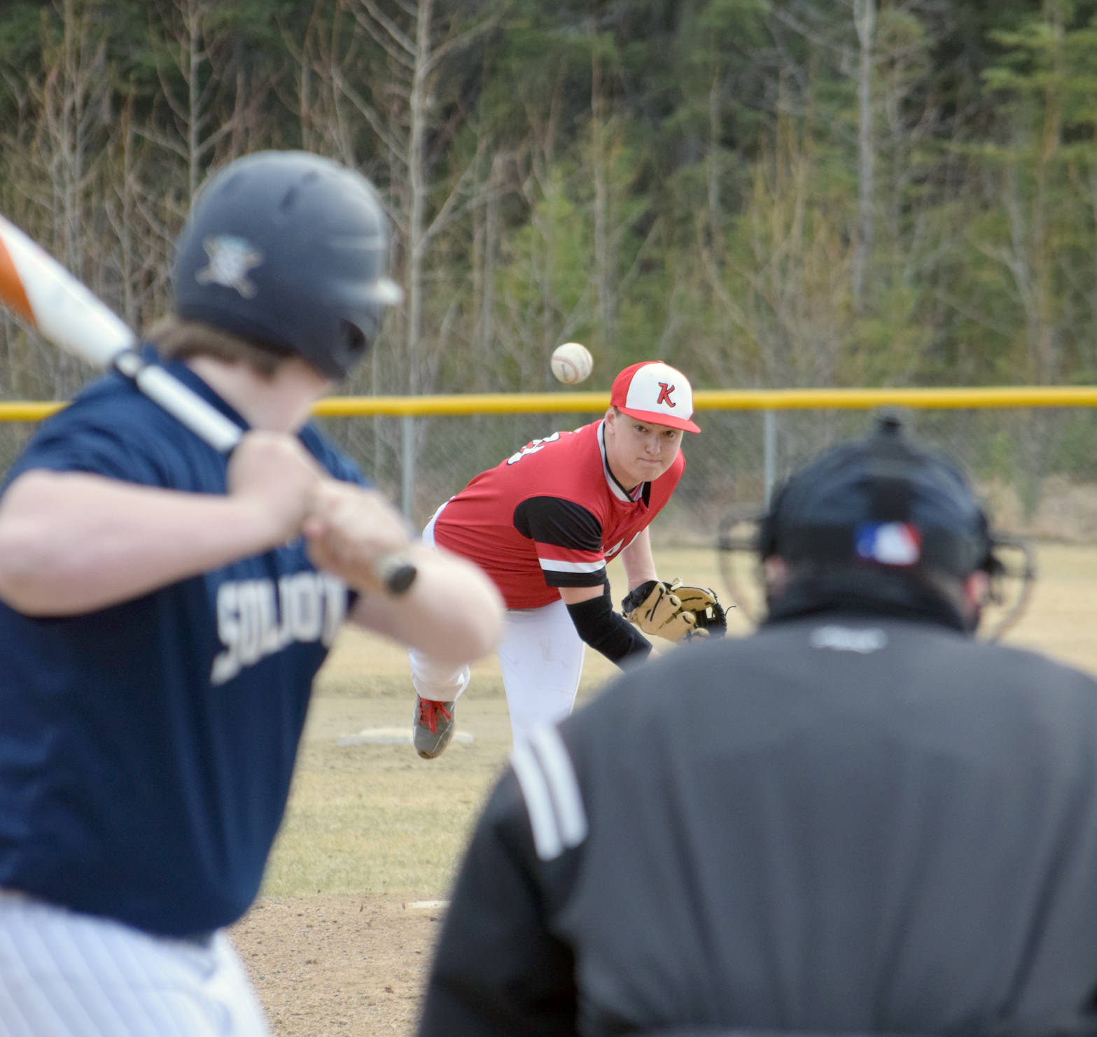 Kenai Central pitcher Knox Amend delivers to Soldotna’s Jake Marcuson on Monday, May 14, 2018, at the Soldotna Little League fields. (Photo by Jeff Helminiak/Peninsula Clarion)