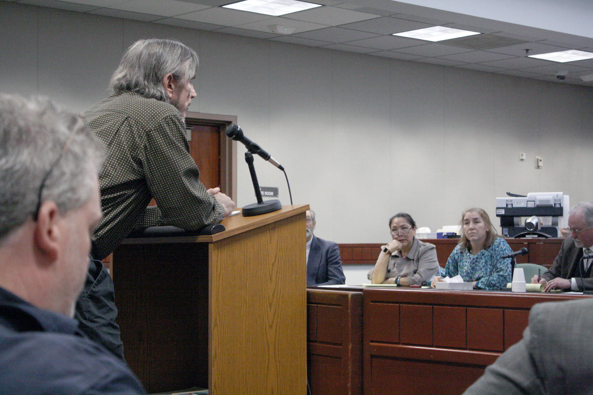 Nikiski resident James Price speaks to members of the Alaska Judicial Council during a public hearing on the applicants seeking to replace retiring Superior Court Judge Anna M. Moran on Wednesday at the Kenai Courthouse. The seven-member Alaska Judicial Council chose to forward the names of Kenai Assistant Attorney General Lance Joanis and Valdez District Court Judge Daniel Schally to Gov. Bill Walker for consideration. (Photo by Erin Thompson/Peninsula Clarion)