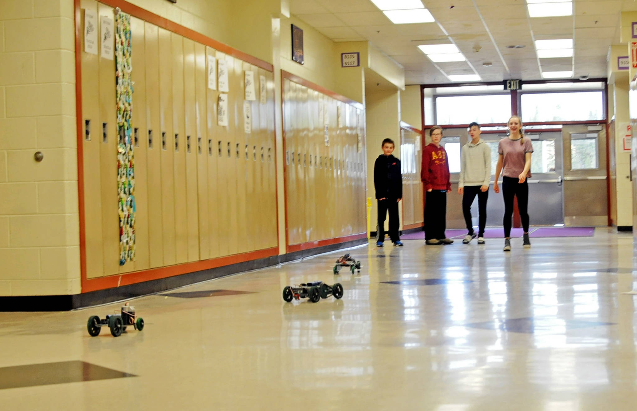 Students in Shelly Church’s robotics class through the “Project Lead the Way” program race the robotic cars they built down the hallway at Skyview Middle School on Thursday, May 17, 2018 in Soldotna, Alaska. Andeavor presented the Kenai Peninsula Borough School District with a $175,000 check Thursday to support programs in career and technical education, including purchasing new computers and carts for Project Lead the Way, additional funds for the Upstream Academies and the Career and Technical Education program SkillsUSA. (Photo by Elizabeth Earl/Peninsula Clarion)