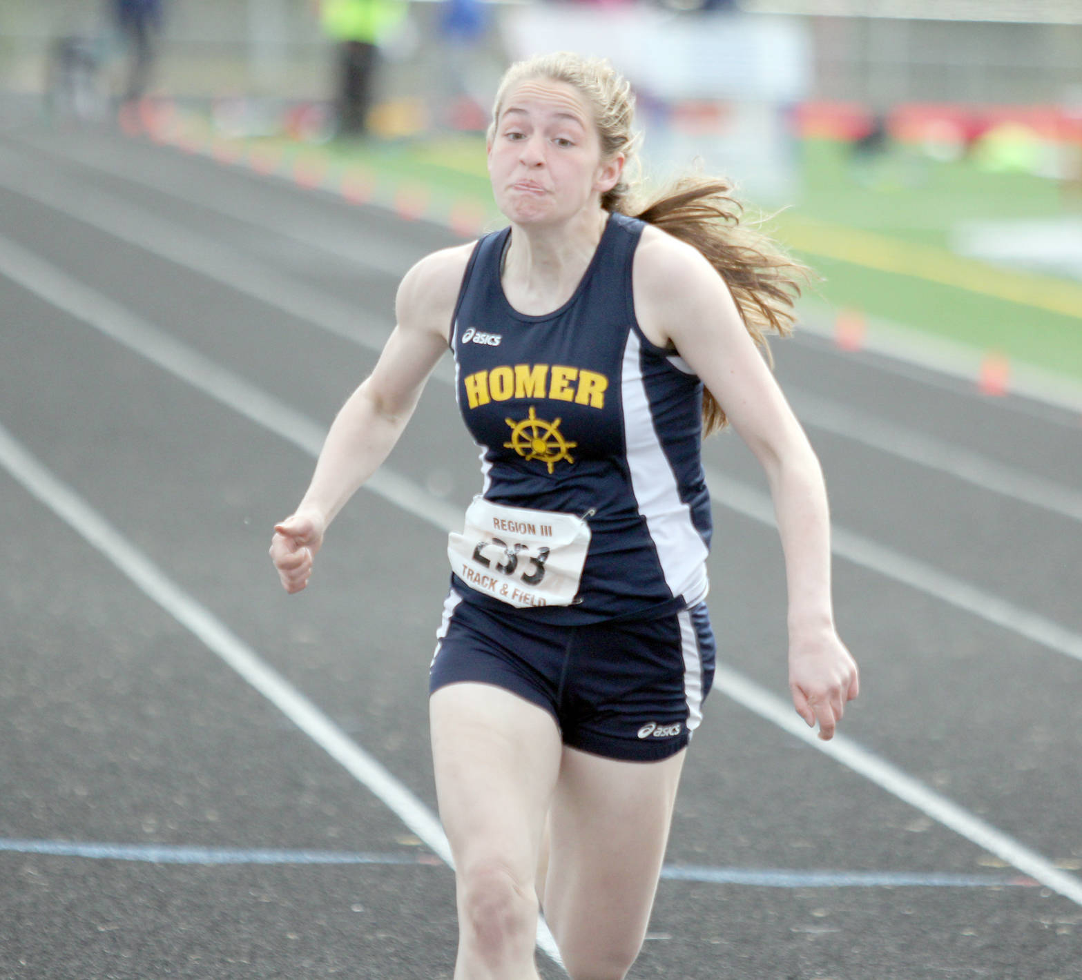 Homer High’s Laura Inama sprints to the finish line in the Division II girls’ 100 meters during the Region III Championships Saturday, May 19, 2018, at Houston High School. (Photo by Jeremiah Bartz/Frontiersman.com)