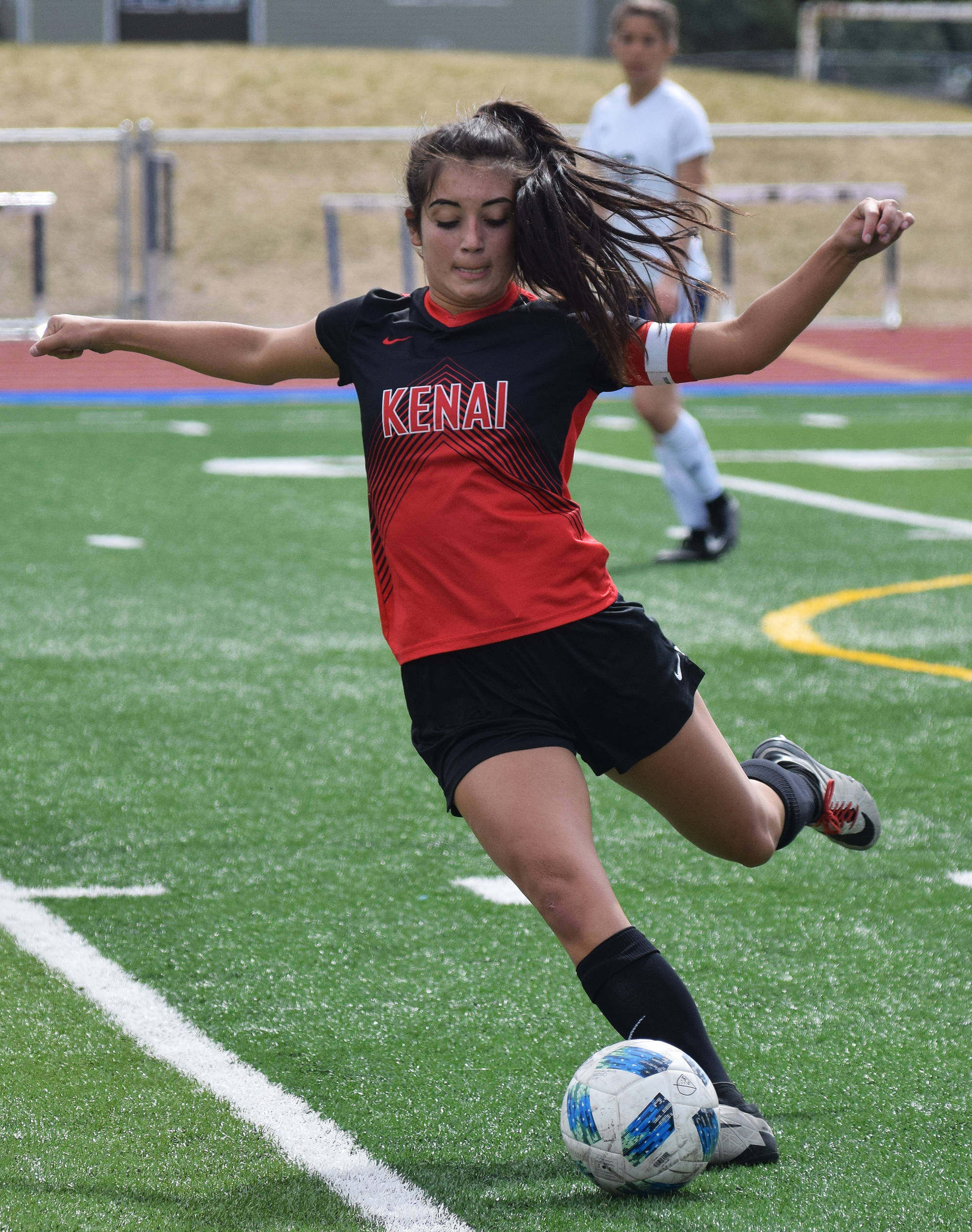 Kenai Central’s Brenna Eubank winds up for a kick May 19, 2018, in the Peninsula Conference girls soccer championship at Soldotna High School. (Photo by Joey Klecka/Peninsula Clarion)