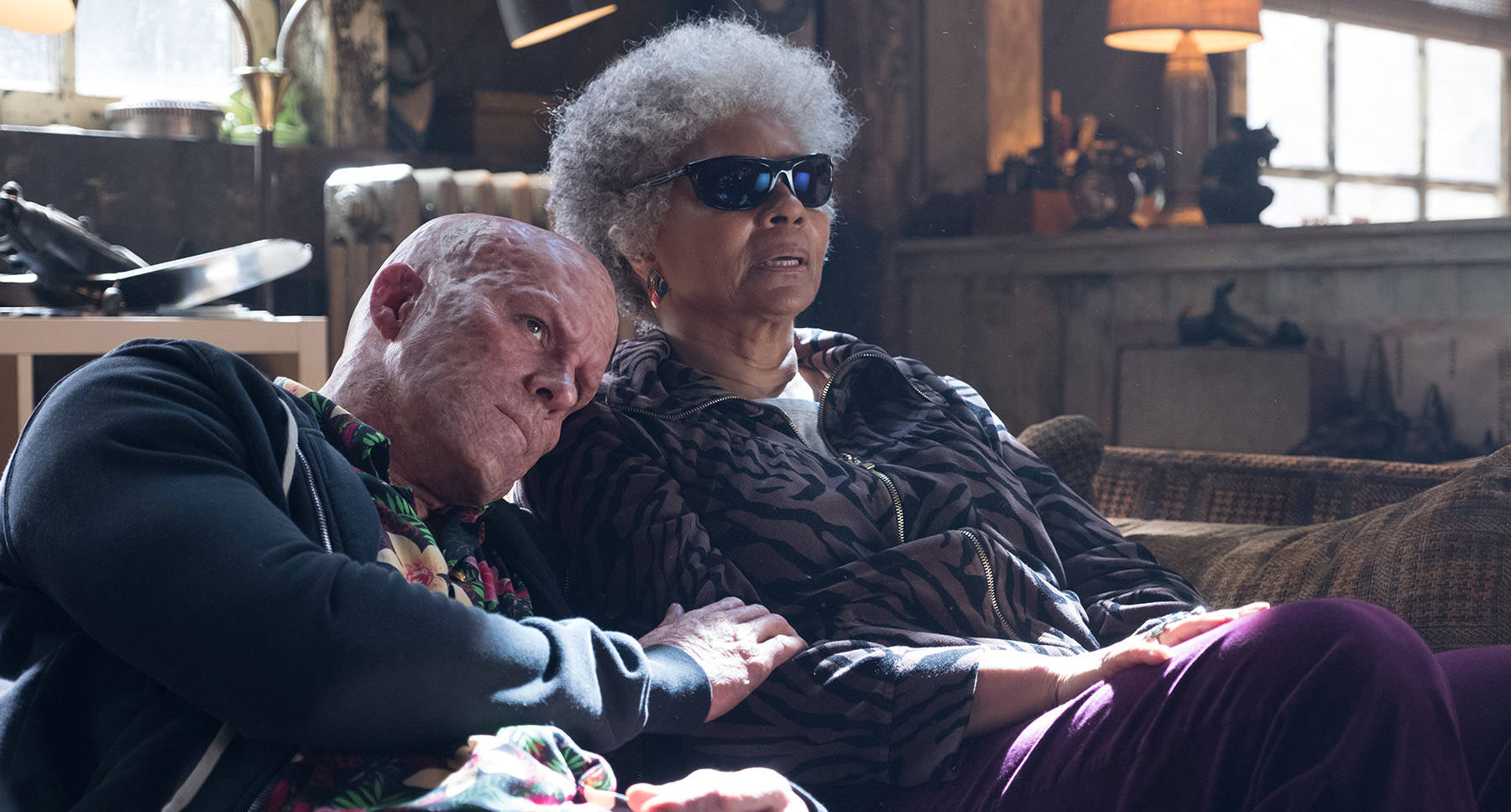 In this film still from “Deadpool 2” released by 20th Century Fox, Wade Wilson (Ryan Reynolds) leans on Blind Al (Leslie Uggams). (Photo courtesy 20th Century Fox)