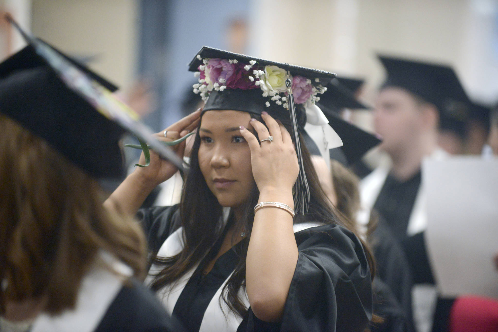 Graduates wait to enter the Nikiski High School auditorium ahead of the 2018 commencement ceremony. (Photo by Erin Thompson/Peninsula Clarion)