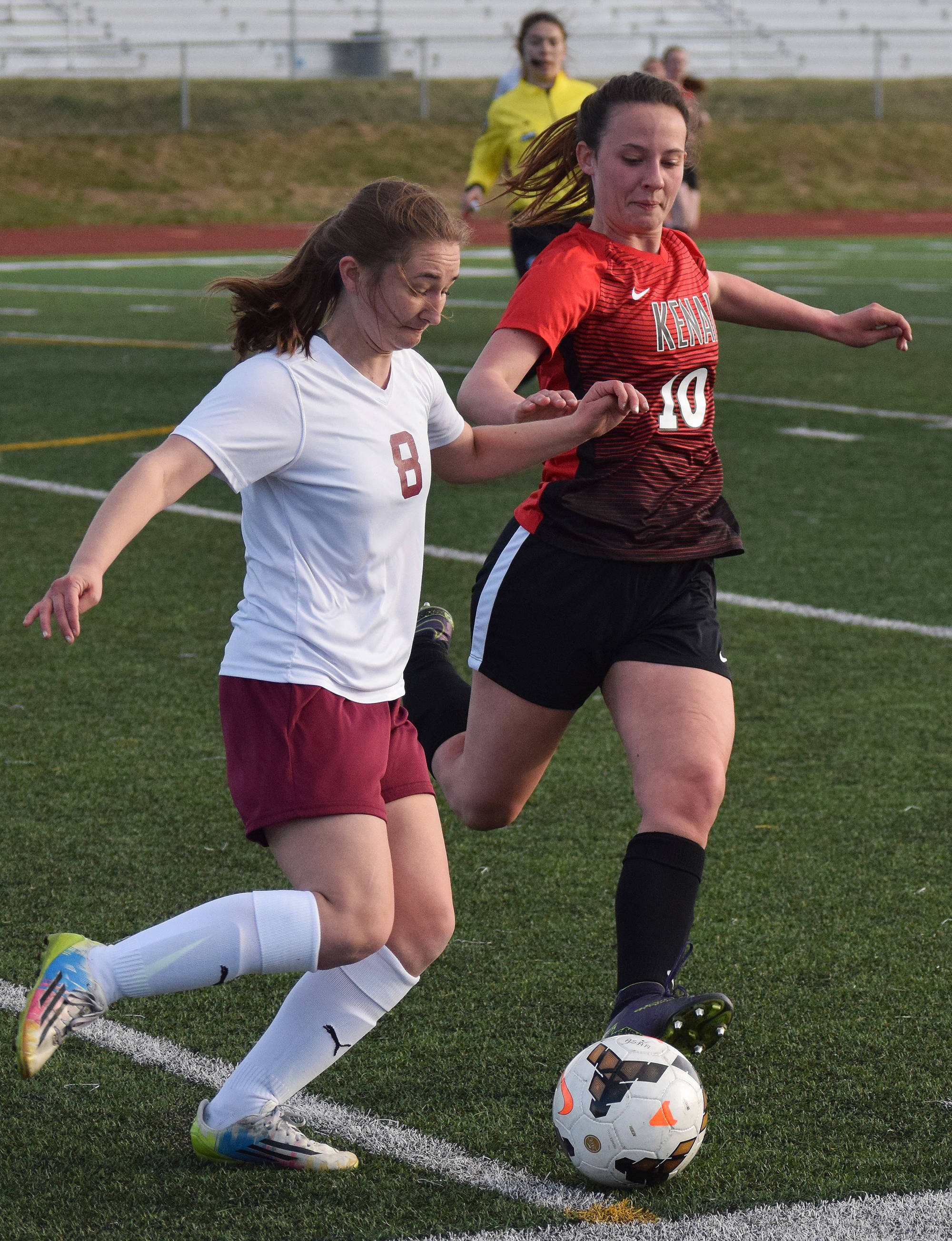 Kenai’s Savaya Bieber (10) battles for the ball against Anna Christiansen of Grace Thursday in the Division II state soccer tournament at Service High School. (Photo by Joey Klecka/Peninsula Clarion)
