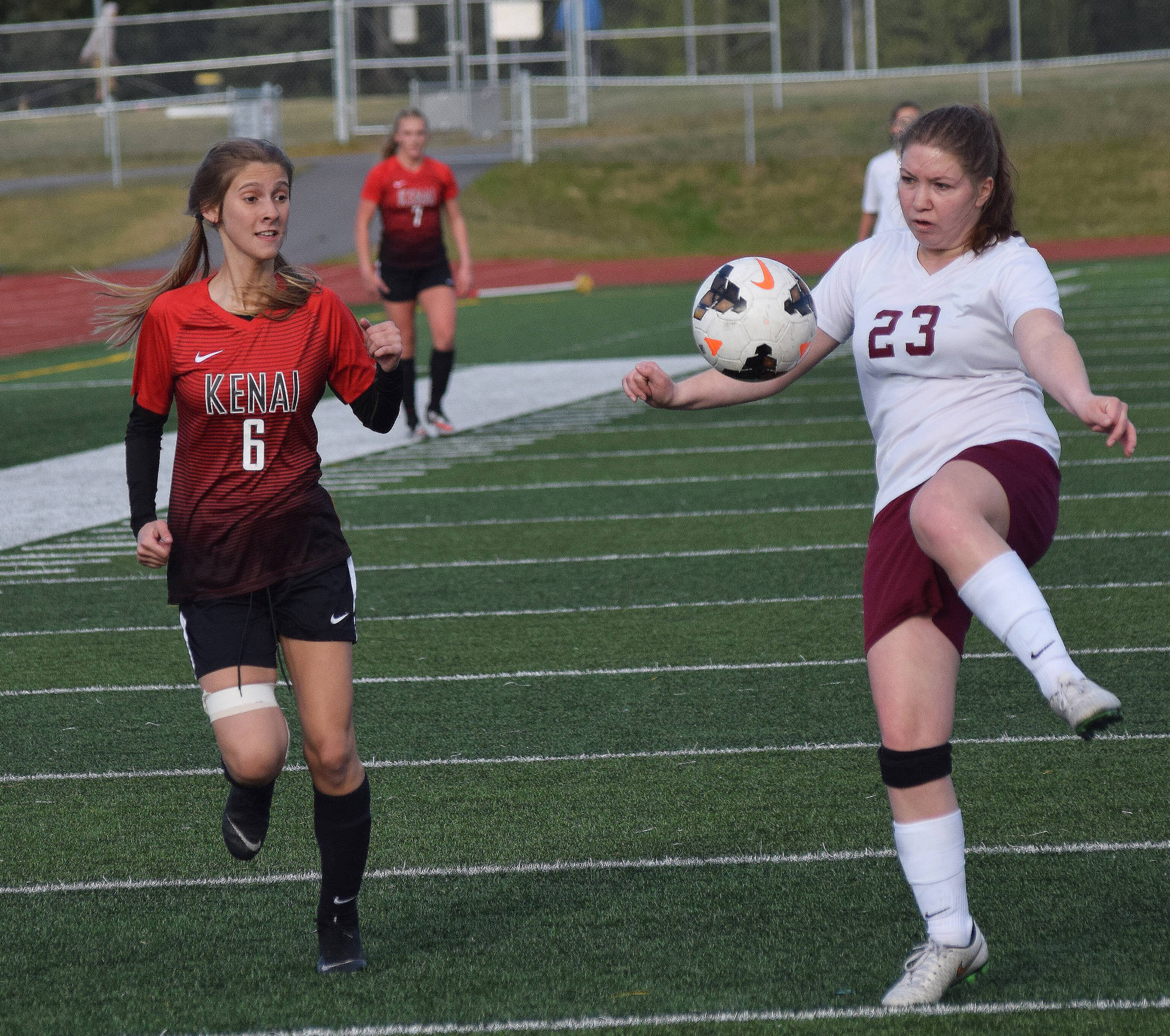 Kenai’s Karley Harden (6) vies for an air ball against Grace’s Karena Bartlett Thursday in the Division II state soccer tournament at Service High School. (Photo by Joey Klecka/Peninsula Clarion)