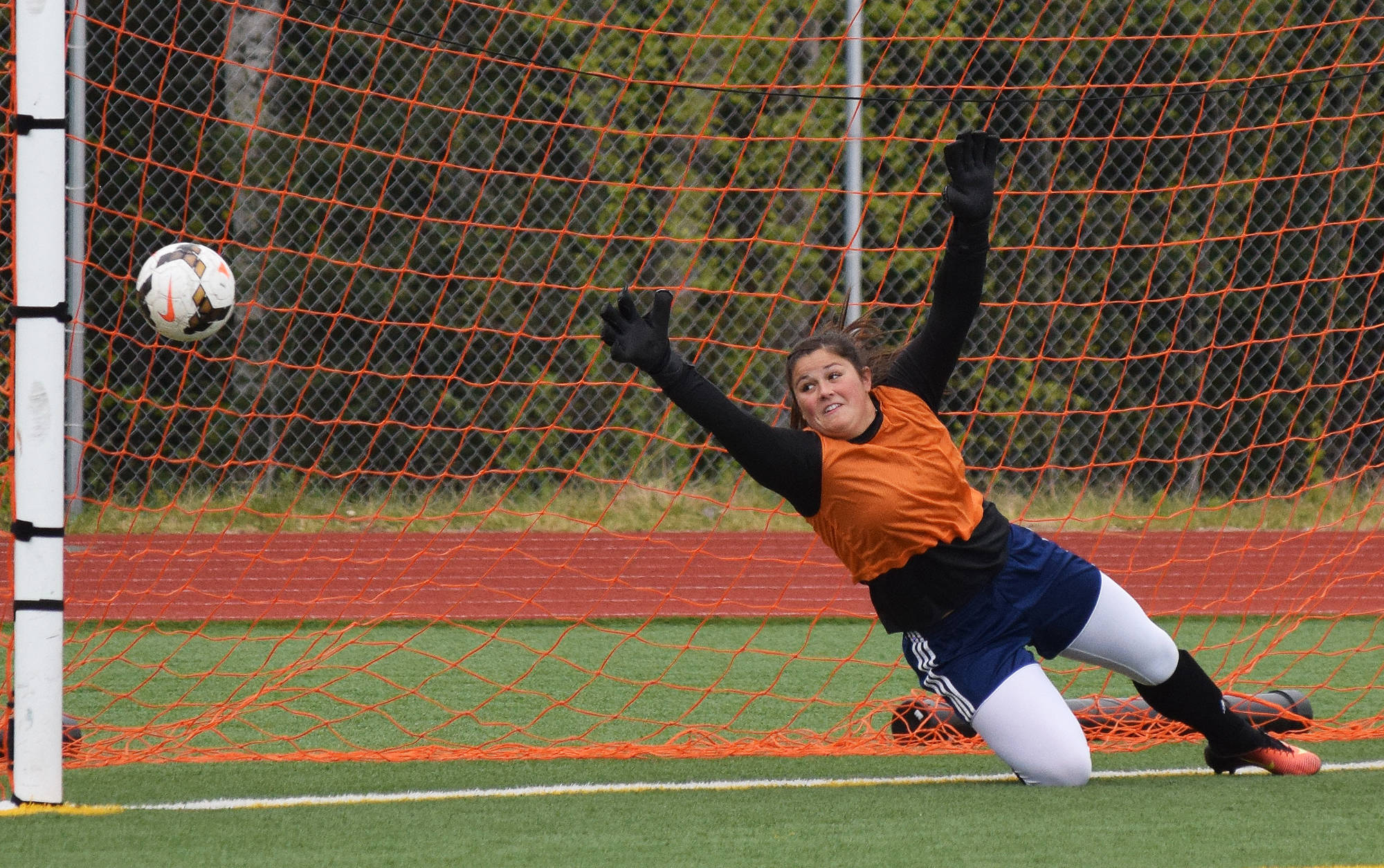 Soldotna goalie Maddie Kindred misses a penalty kick from Grace’s Maddy Morgan Friday in a Division II state tournament semifinal at Eagle River High School. (Photo by Joey Klecka/Peninsula Clarion)
