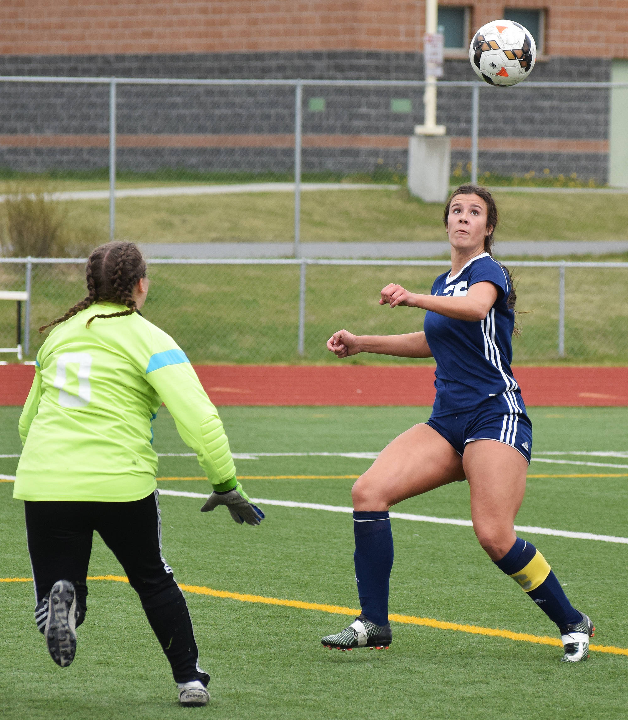 Soldotna senior Whitney Wortham puts a shot on Grace goalie Colleen Gamez Friday in a Division II state tournament semifinal at Service High School. (Photo by Joey Klecka/Peninsula Clarion)