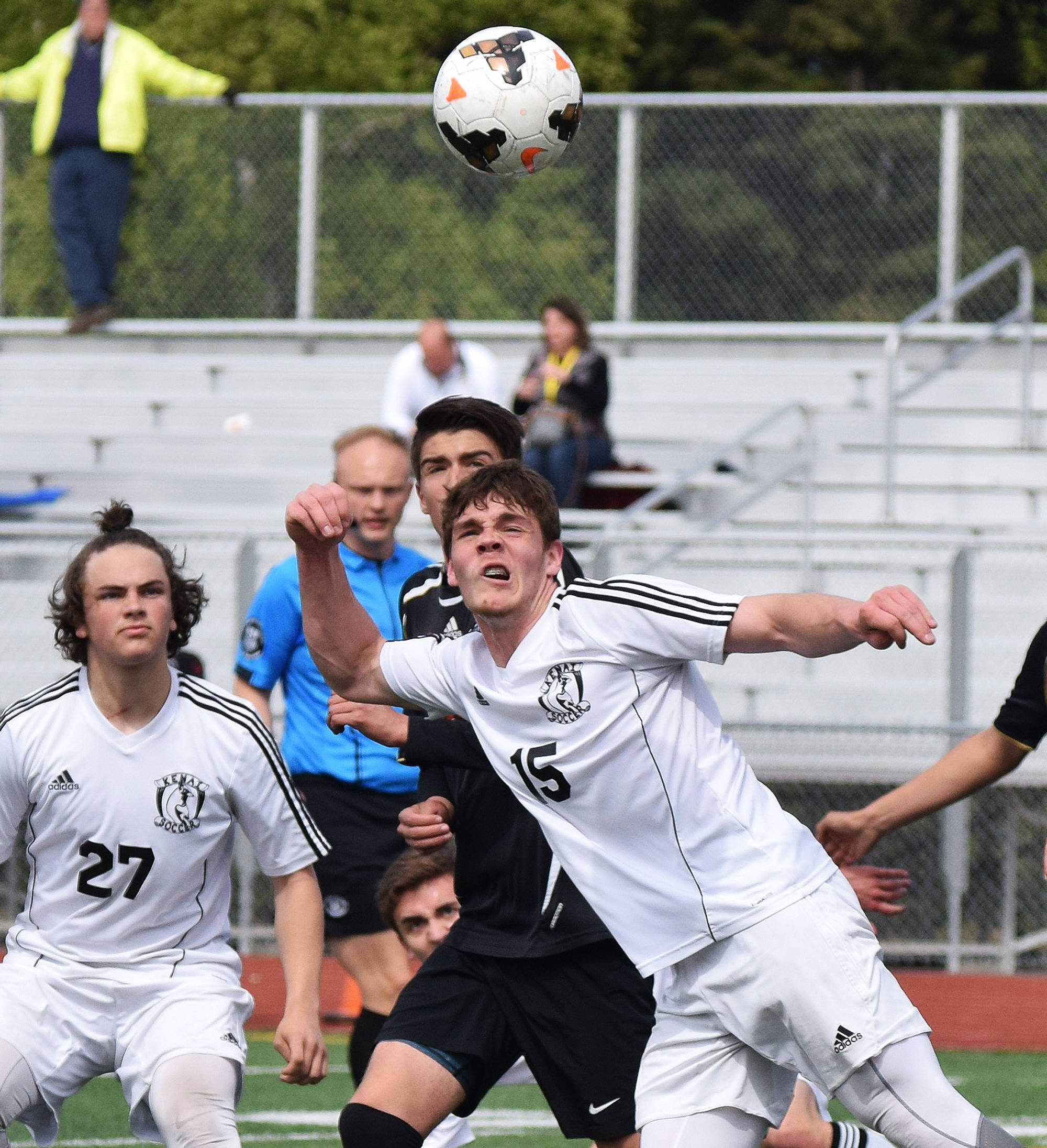 Kenai’s Titus Riddall (15) puts a head on the ball in the Division II state soccer championship final against Juneau-Douglas Saturday afternoon at Service High School. (Photo by Joey Klecka/Peninsula Clarion)