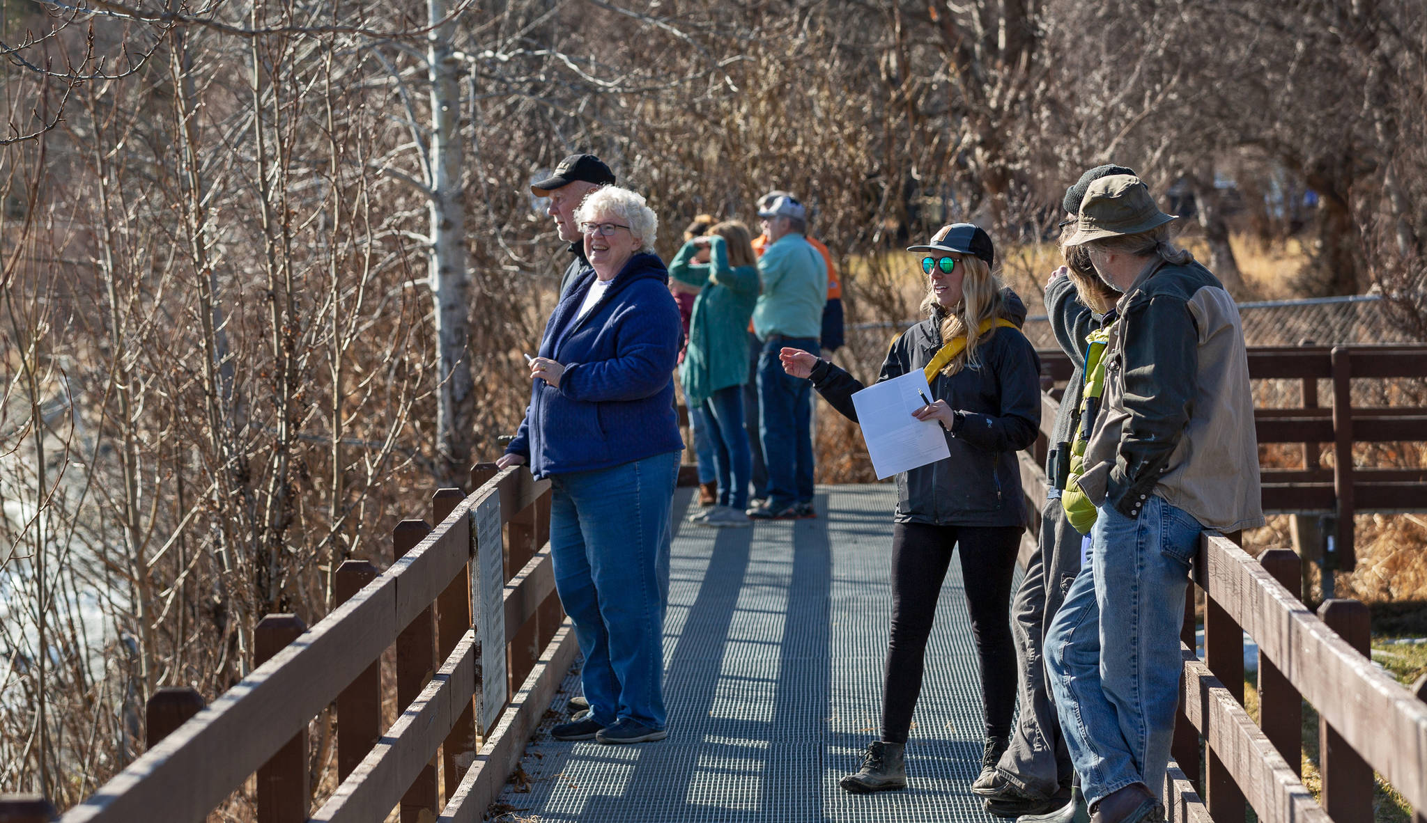 Beluga researcher Kim Ovitz (center, with sunglasses) and a group of volunteer whale-watchers look for belugas in the Kenai River on April 14, 2018 at Cunningham Park in Kenai, Alaska. 11 signed-up volunteers and several more casual ones helped Ovitz with her observations, which began March 15 and will continue until May 31. Her preliminary results suggest that a large portion of Cook Inlet’s estimated 328 belugas travel the Kenai River with the tides in early spring. (Photo courtesy of Rickard Sjoeberg).