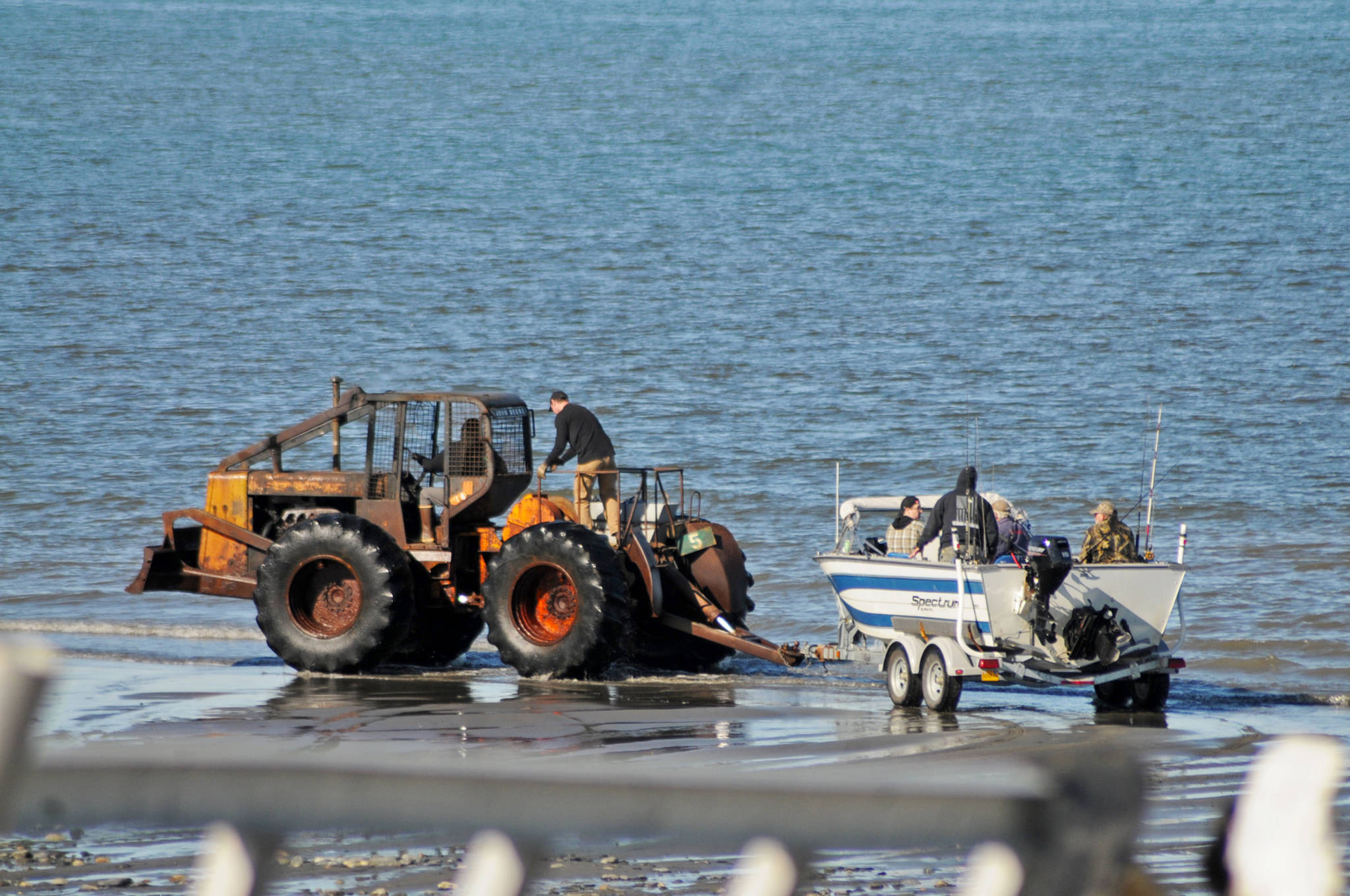 Anglers prepare to head out onto Cook Inlet from the tractor launch at Deep Creek State Recreation Site on Sunday, May 28, 2018 in Ninilchik, Alaska. Halibut fishing has been reportedly fair so far this year, with anglers regularly landing halibut smaller than 100 pounds and a few over 100 pounds out of Ninilchik. (Photo by Elizabeth Earl/Peninsula Clarion)
