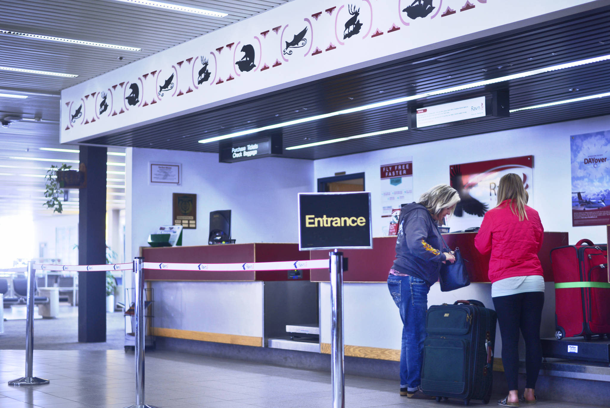 Travelers check baggage with airline Ravn Alaska at the Kenai Muncipal Airport on Thursday, May 31, 2018. Kenai’s city government is seeking to raise rents that Ravn and the Kenai airport’s other airline, Grant Aviation, pay for terminal space such as their ticket counters. (Ben Boettger/Peninsula Clarion)