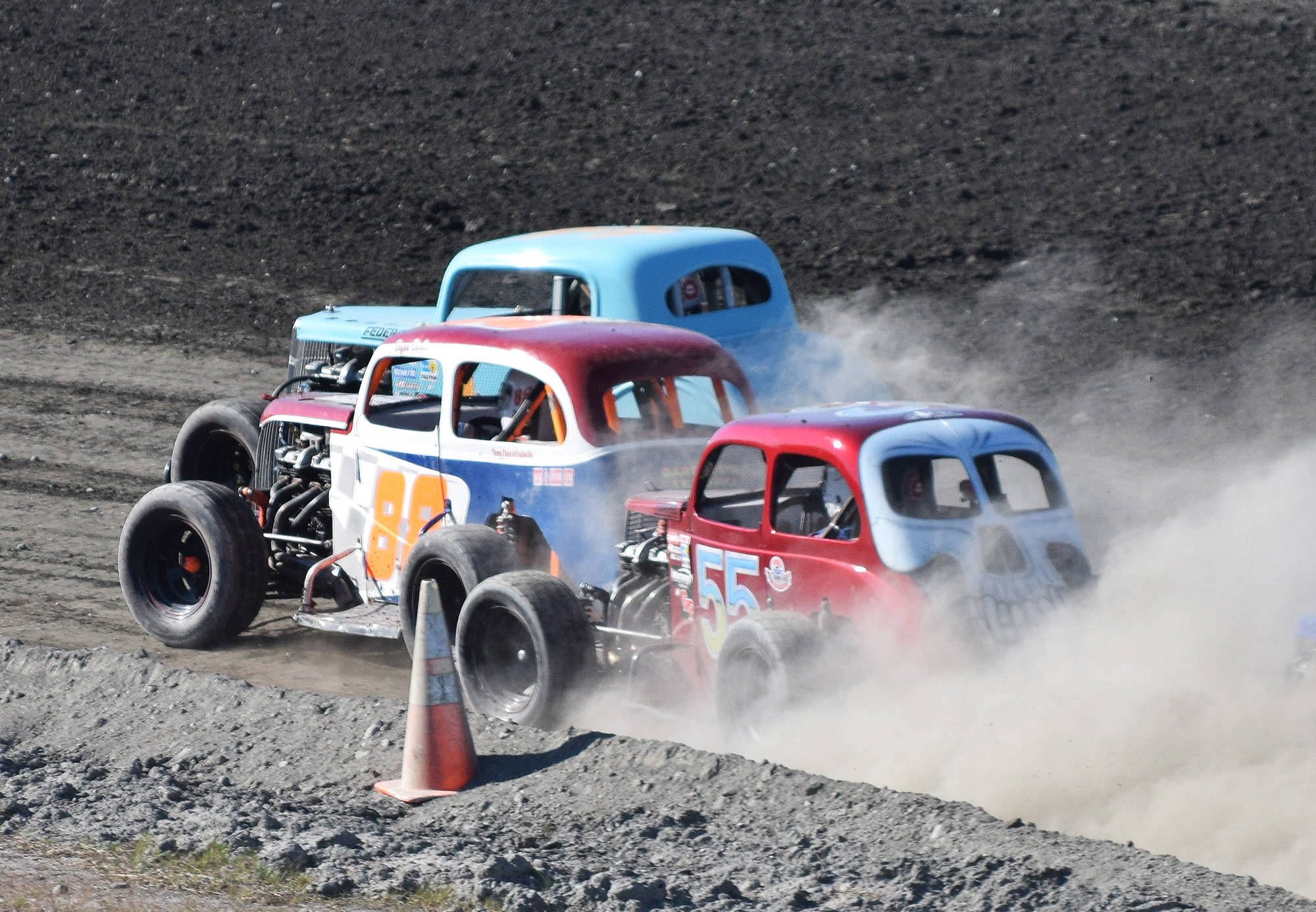 Bryan Barber (88) lead a tight pack of Legends drivers Saturday night at Twin City Raceway in Kenai. (Photo by Joey Klecka/Peninsula Clarion)