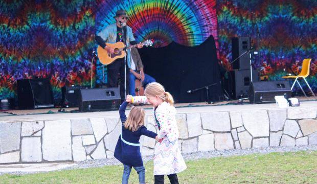 Grayson Besse, 5, gives Bensen Besse, 2, a twirl while dancing during the 2017 Kenai River Festival on Saturday, June 10, 2017 at Soldotna Creek Park in Soldotna, Alaska. (Clarion file photo)