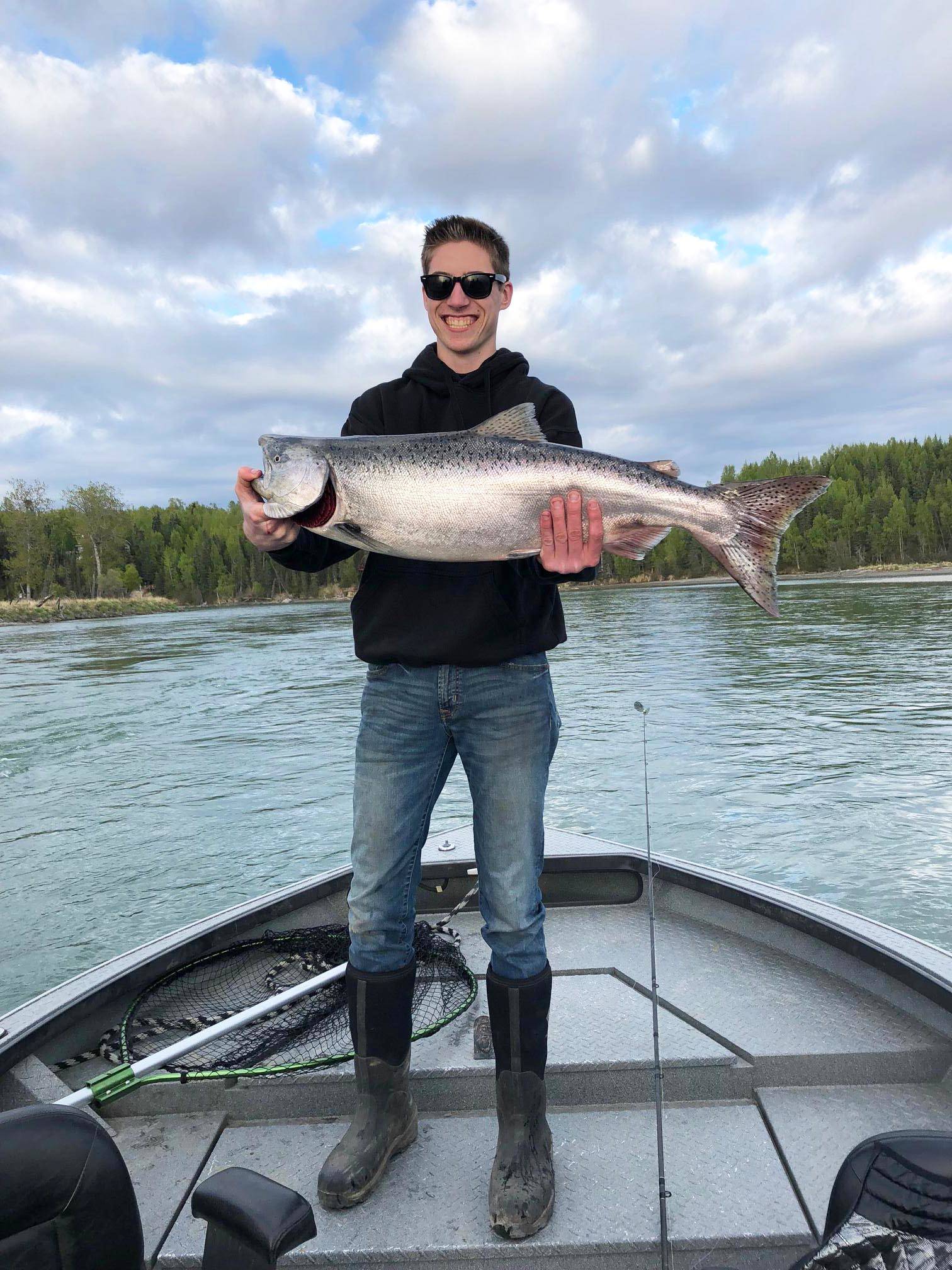 Jesse Rogde holds the 34-inch Kenai River king salmon he caught on Memorial Day on the lower Kenai River. (Photo courtesy Scott Miller)